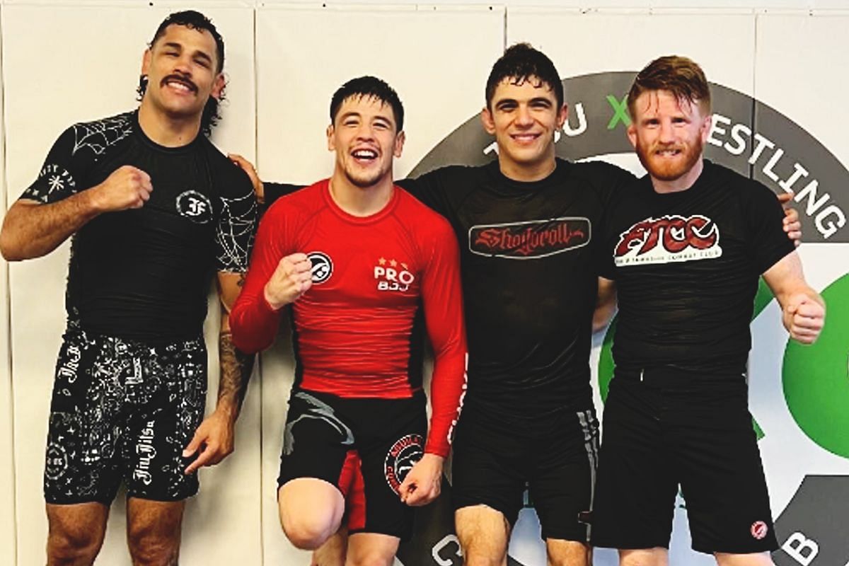 Mikey Musumeci (second from right) rolls with Brandon Moreno (second from left) in Las Vegas.