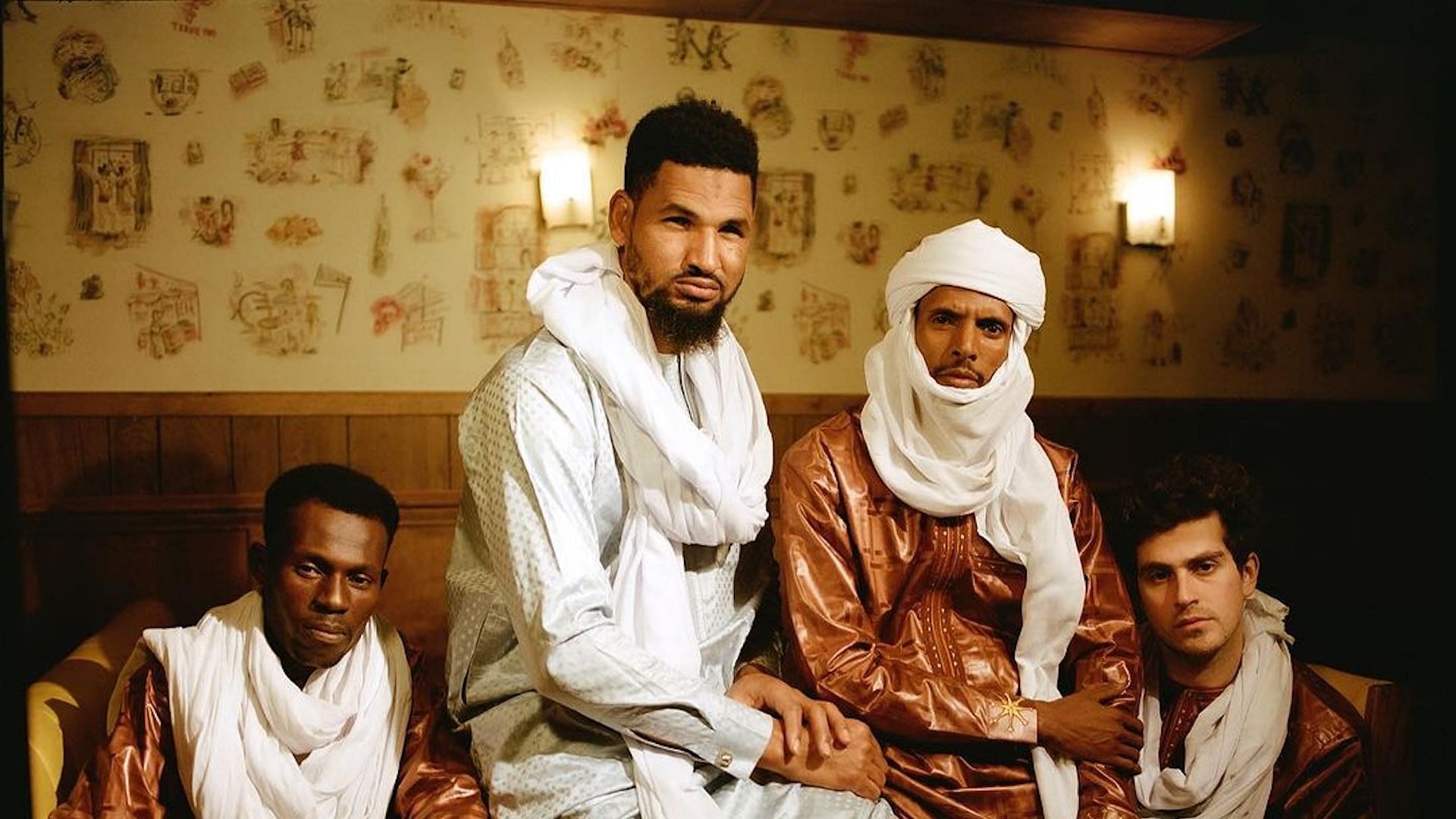 Mdou Moctar (in white) posing with his friends and fellow musicians promoting his new album &#039;Funeral for Justice&#039; (Image via Instagram/@mdou_moctar)