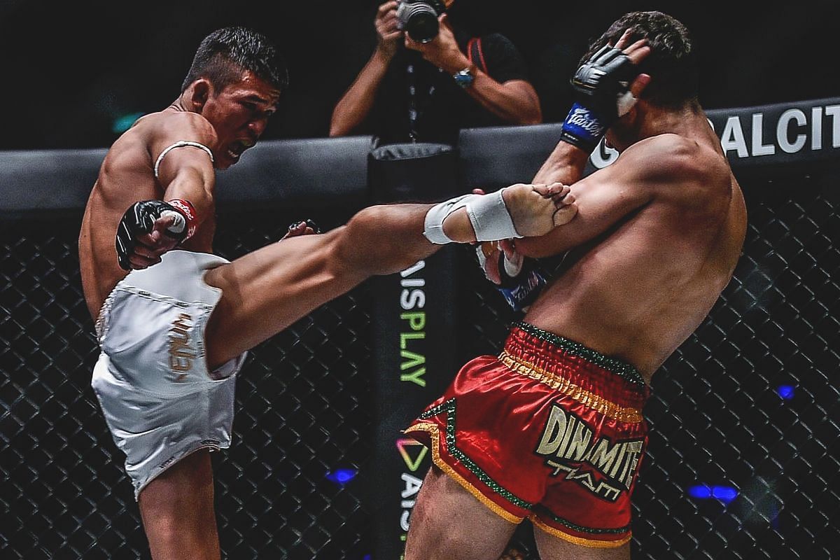Superlek lands a roundhouse kick against Rui Botelho in their 2019 showdown.