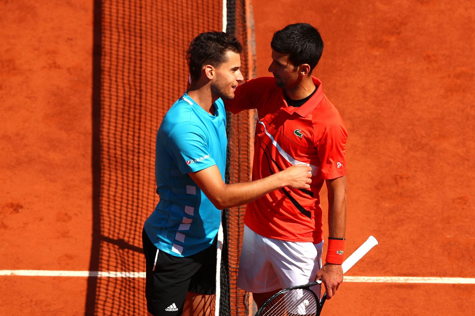Dominic Thiem and Novak Djokovic embrace after 2018 French Open SF