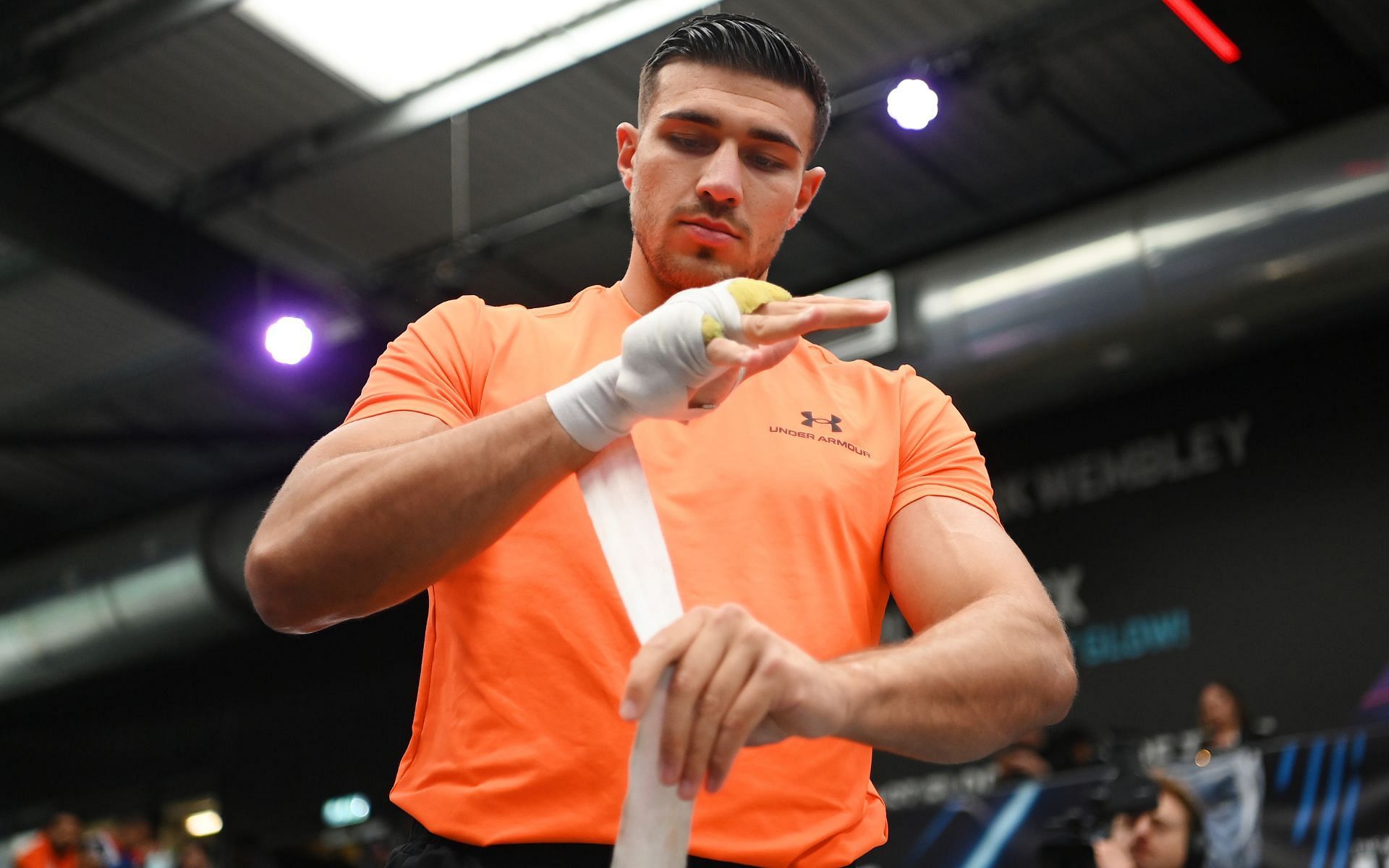 Boxer Tommy Fury (inset) has received extensive guidance from his Fury family mentors and is known to meticulously wrap his hands for training and fights [Image courtesy: Getty Images]