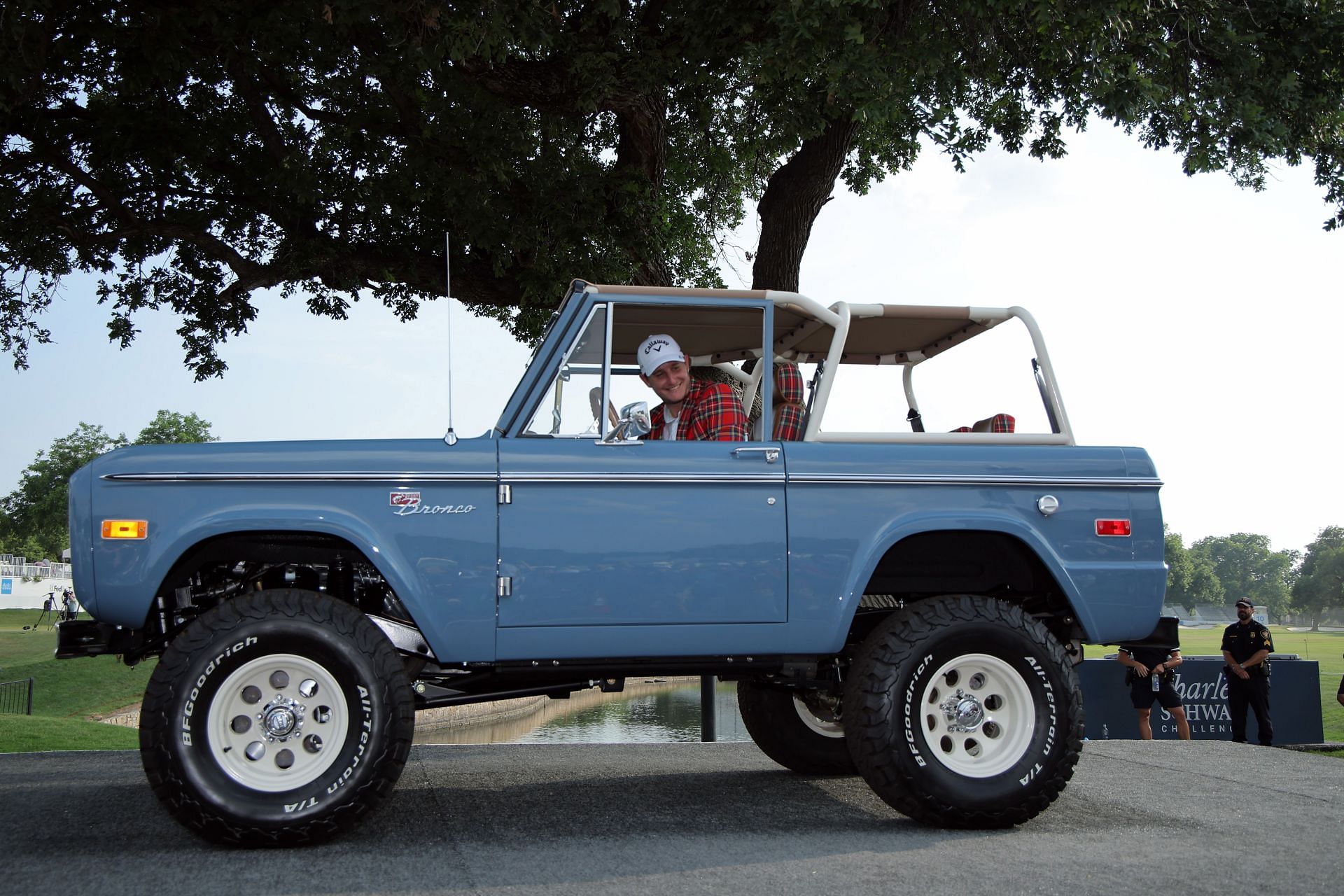 Emiliano Grillo poses in a Ford Bronco after winning the Charles Schwab Challenge 2023