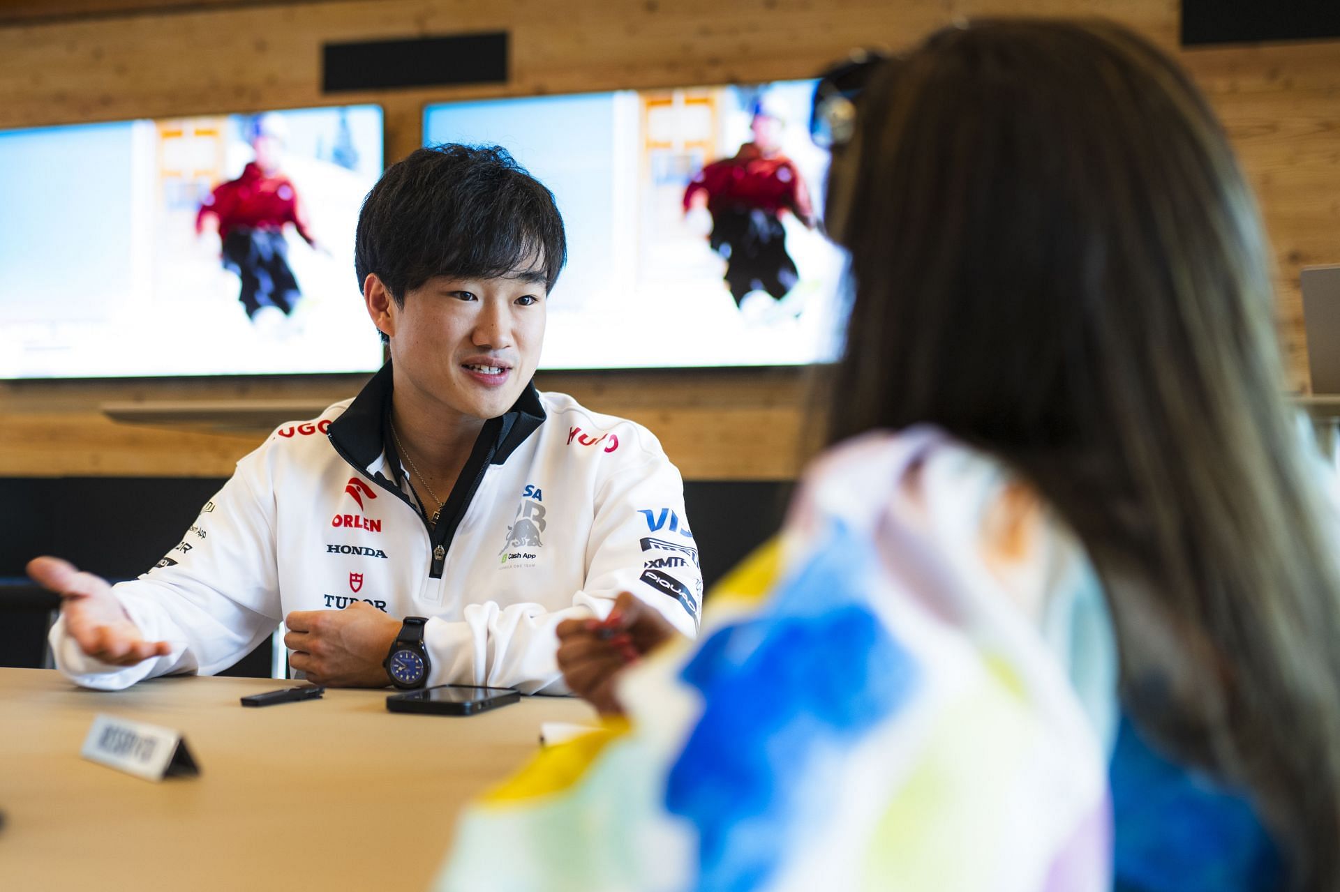 Visa Cashapp RB F1 driver Yuki Tsunoda being interviewed by Sportskeeda