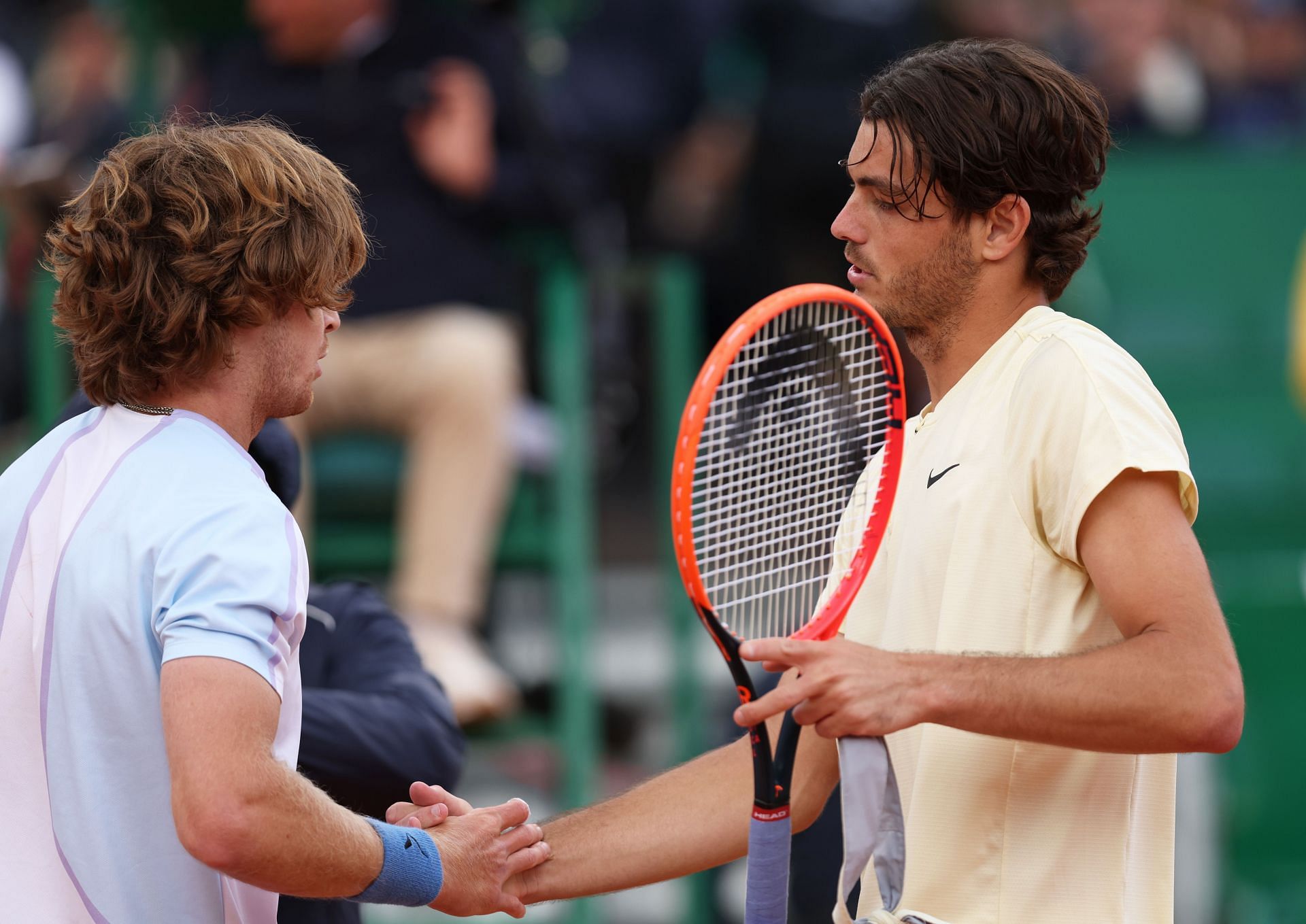 Andrey Rublev and Taylor Fritz embrace after their 2023 Monte-Carlo encounter