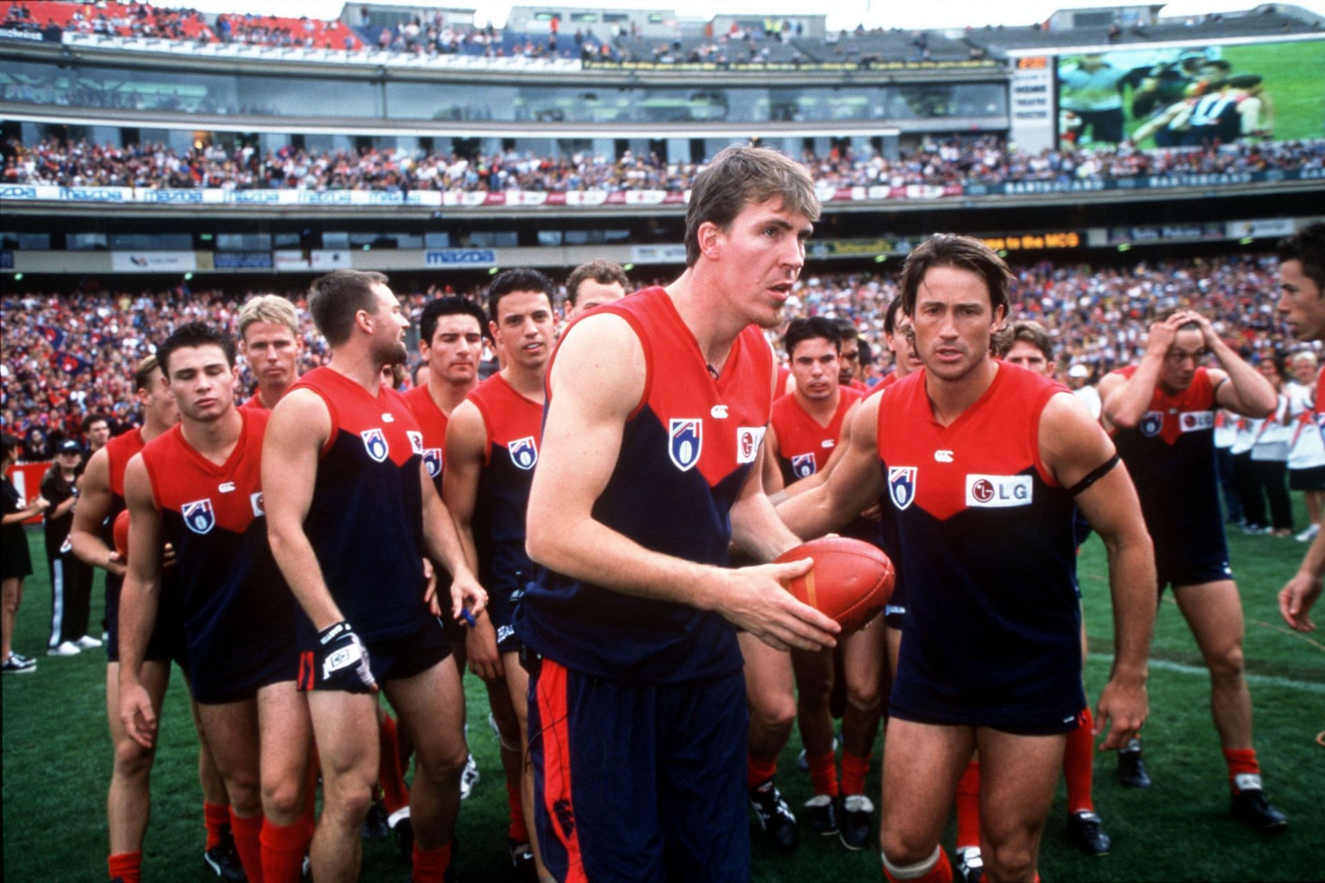 Jim Stynes of Melbourne is honoured by teammates