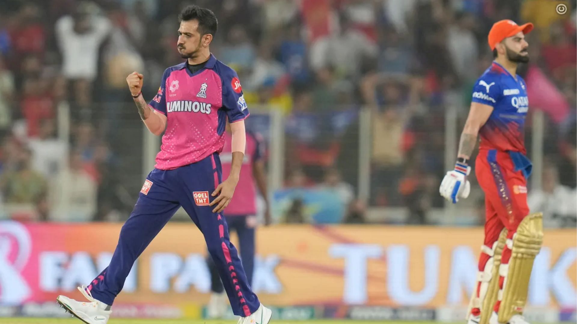 Yuzvendra Chahal (L) celebrates Virat Kohli