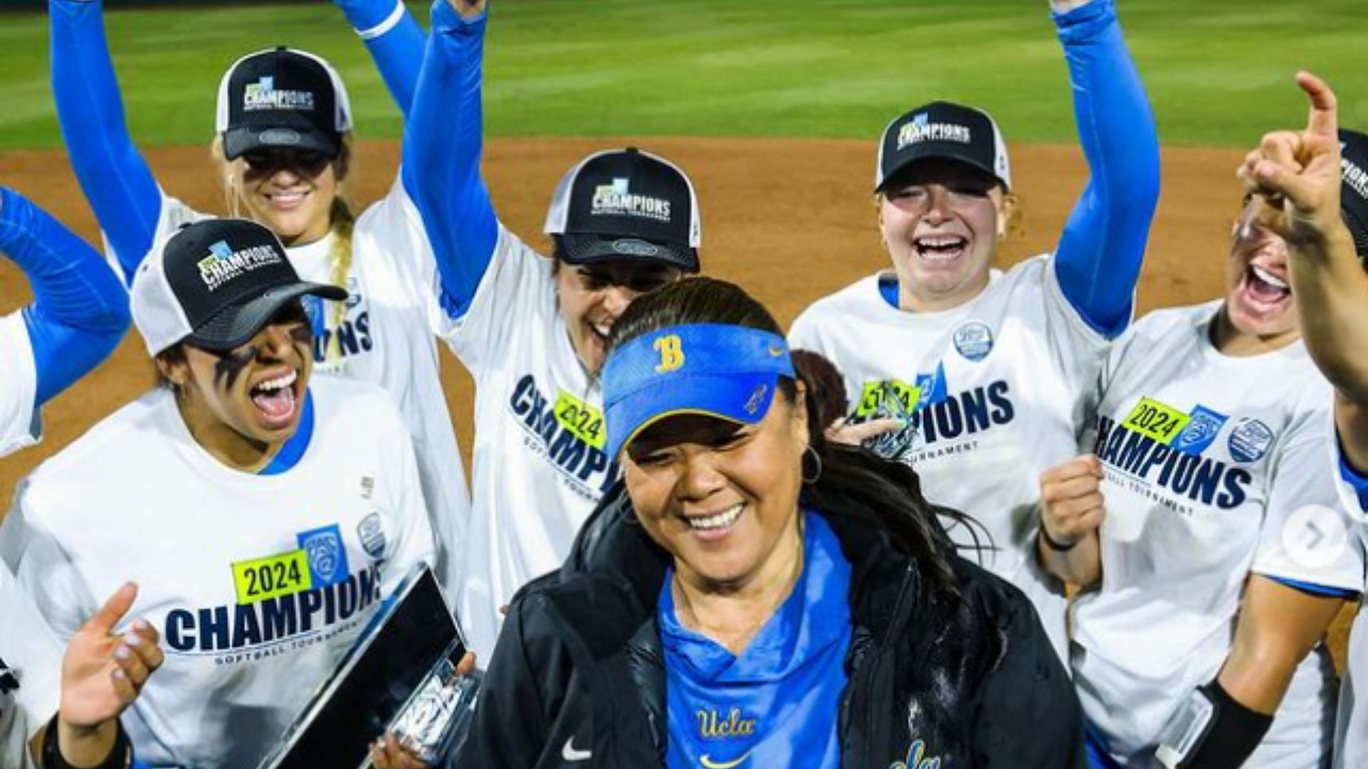 UCLA coach Kelly Inouye-Perez celebrates after the Lady Bruins edged the Utah Utes, 2-1, in the Pac-12 Championship.