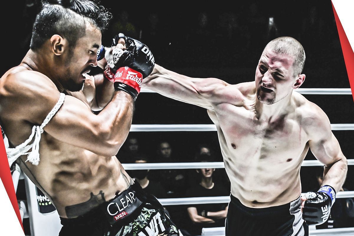 Dmitry Menshikov (R) unloads on Sinsamut | Photo by ONE Championship