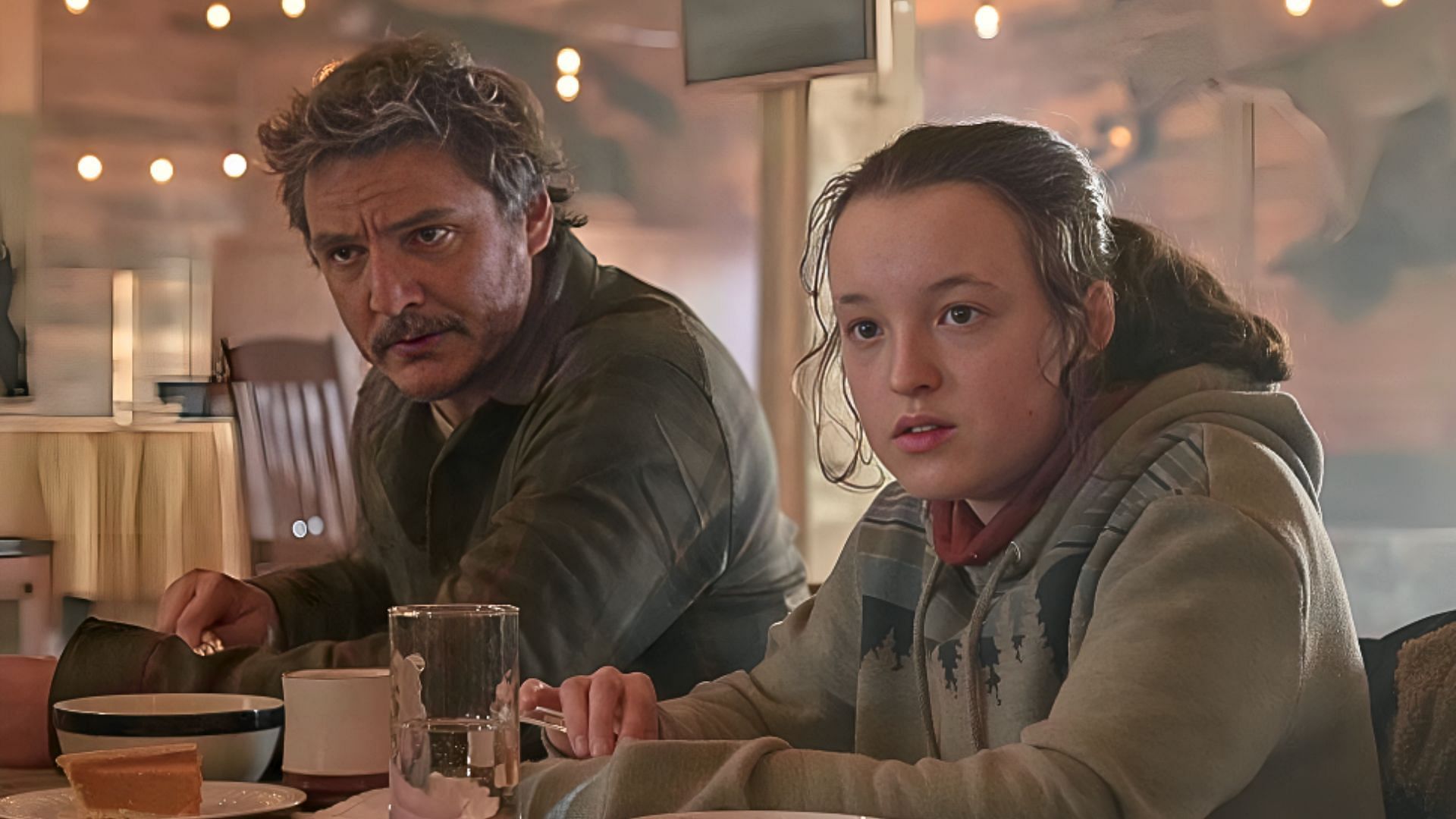 Pedro Pascal (left) and Bella Ramsey (right) in The Last of Us (Image via &copy; 2023 Courtesy of HBO)