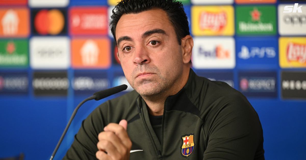 Barcelona boss Xavier Hernandez looks on.