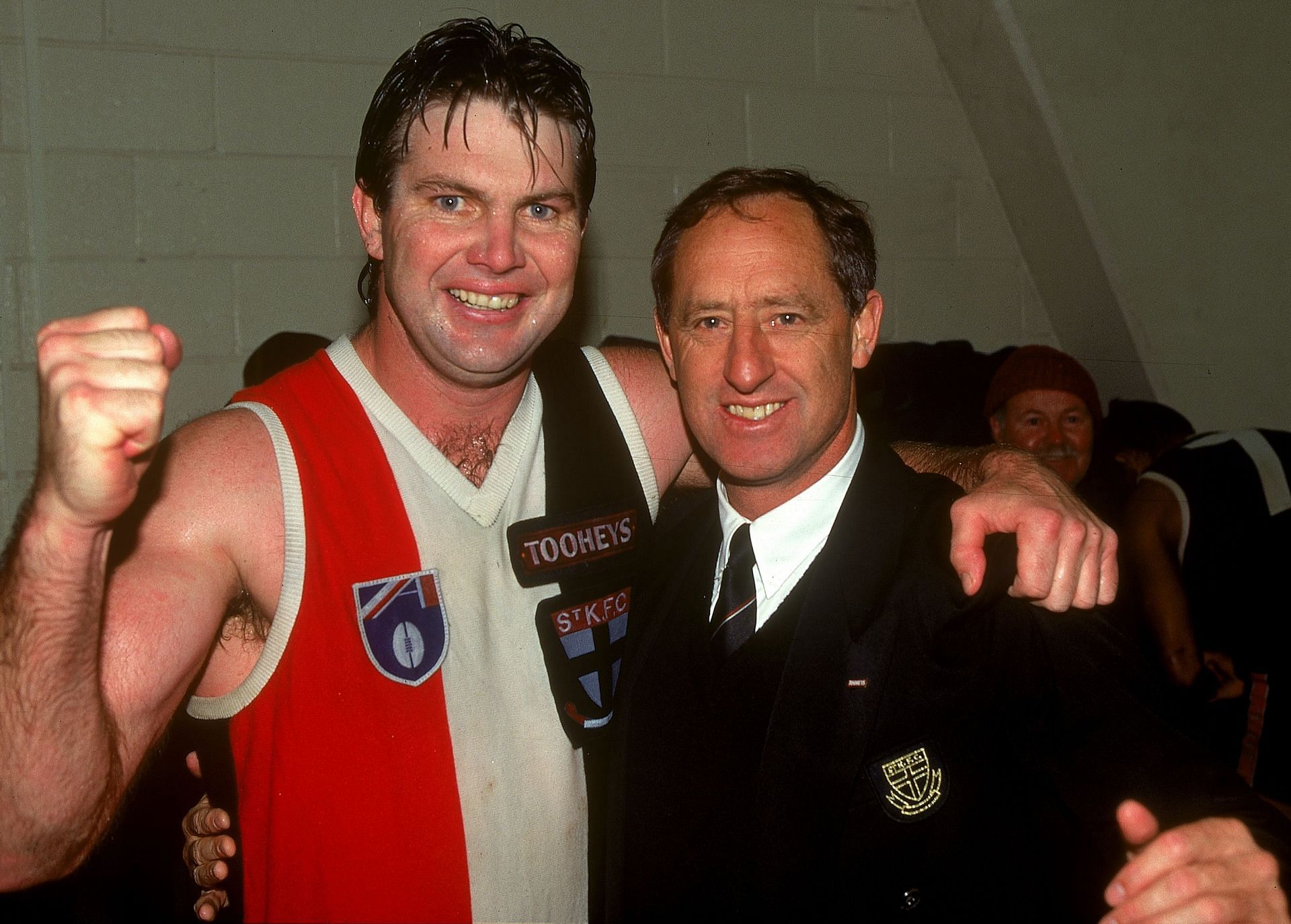 Danny Frawley of the Saints celebrates with coach Stan Alves after a AFL match between the St Kilda Saints and the Carlton Blues