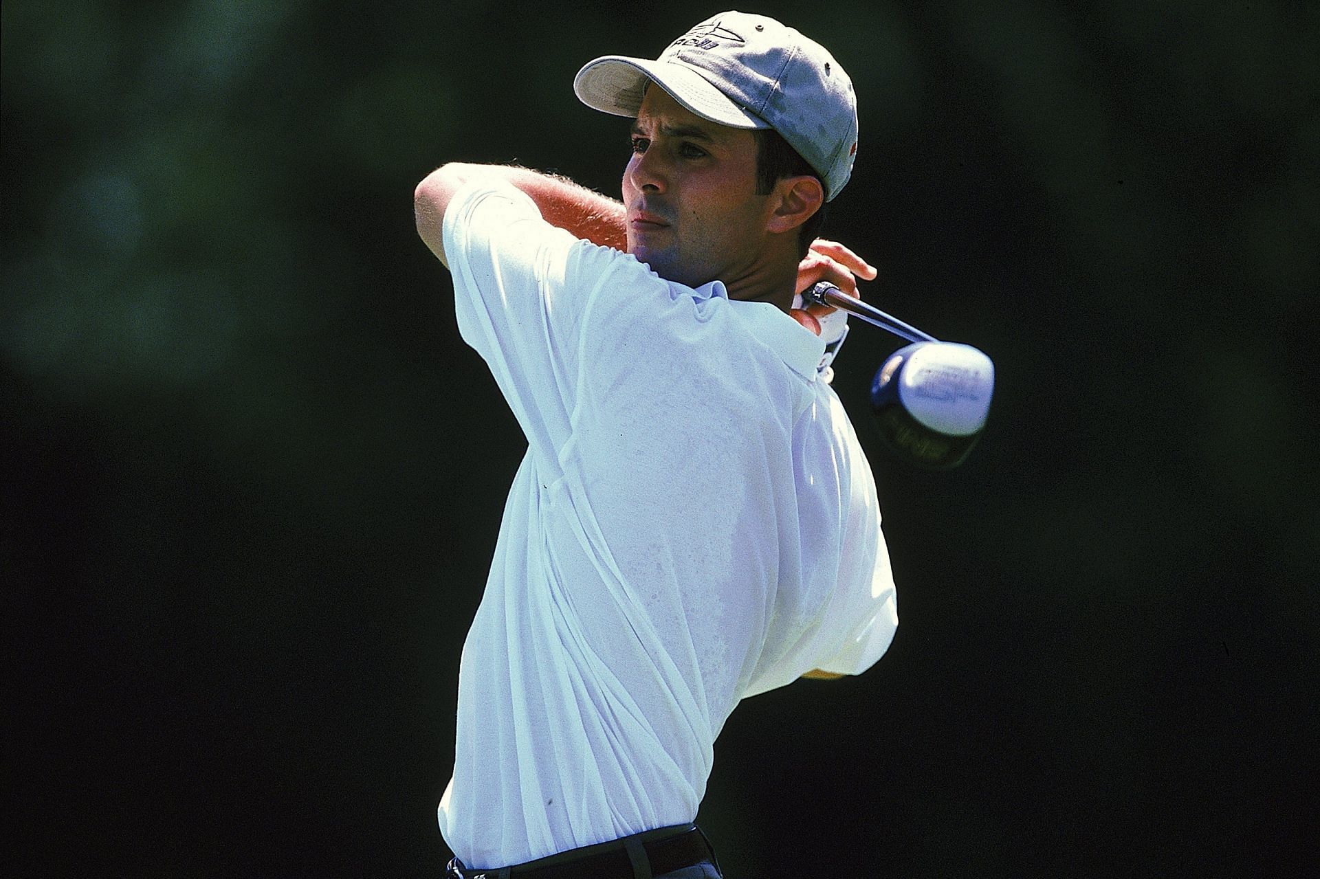 Mike Weir looks at his ball after swinging ,1998 (Image via Getty)