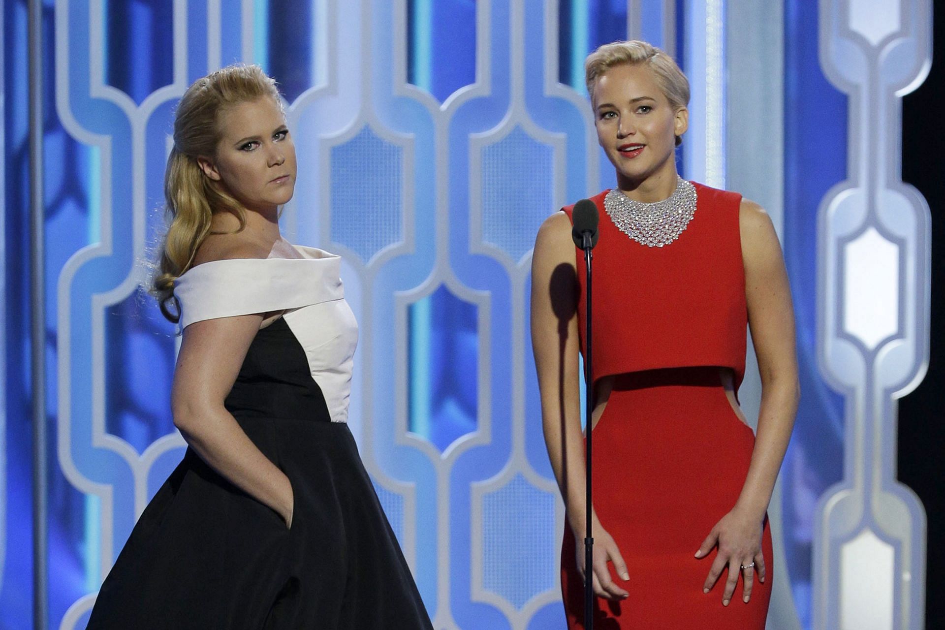 Jennifer Lawrence and Amy Schumer at the 73rd Annual Golden Globe Awards. (Image via Getty)