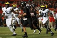 Michigan v Rutgers PISCATAWAY, NJ - OCTOBER 08: Rashan Gary #3 and Kenneth Sloss #40 of the Michigan Wolverines chase down Zach Allen #12 of the Rutgers Scarlet Knights during the second half at High Point Solutions Stadium on October 8, 2016 in Piscataway, New Jersey. (Photo by Michael Reaves/Getty Images)