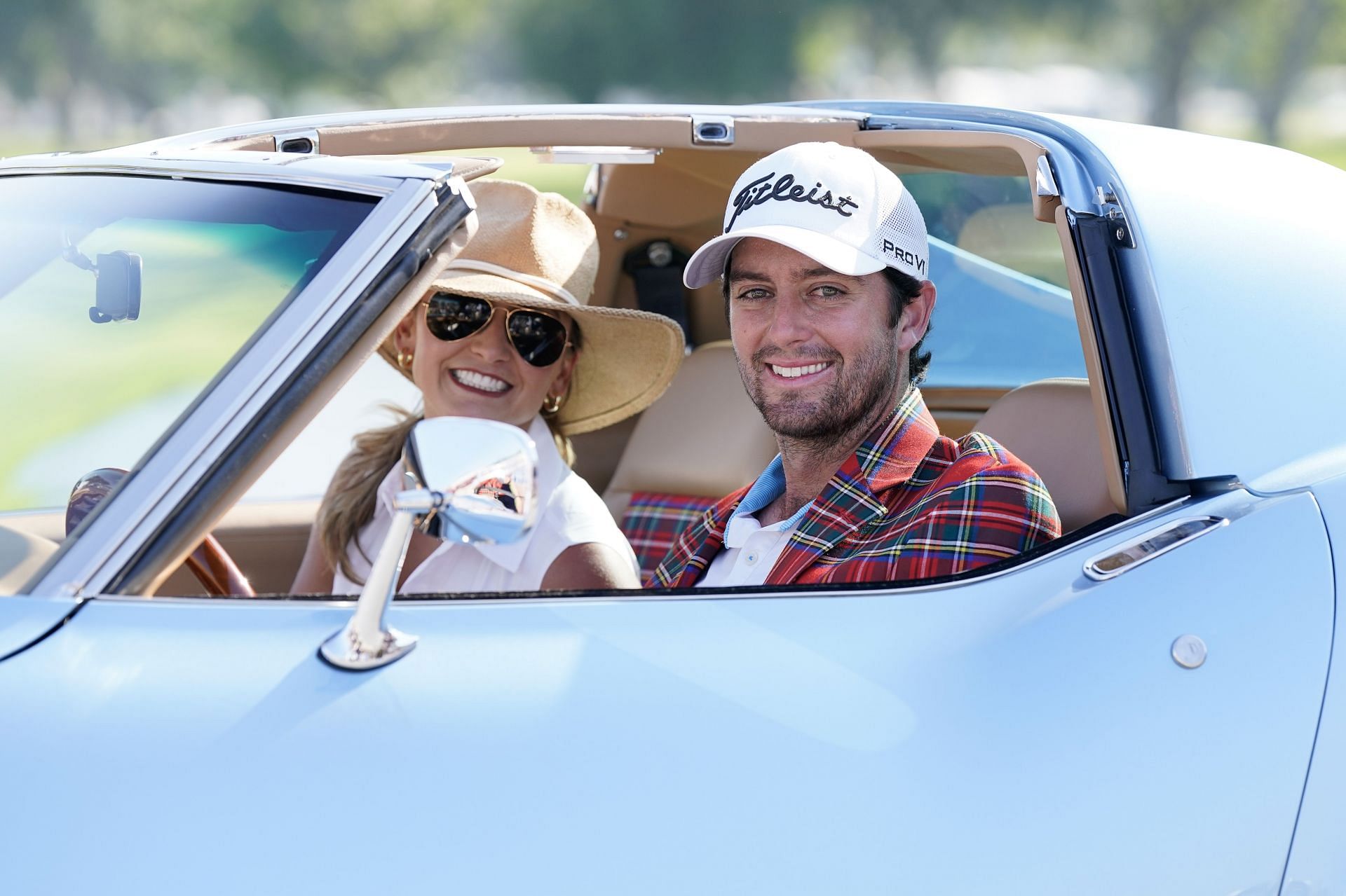 Davis Riley and his wife Alexandra Patton Riley pose with Corvette Stingray after winning the Charles Schwab Challenge
