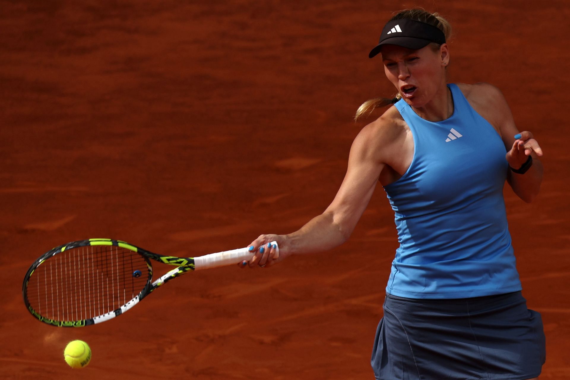 Caroline Wozniacki hits a forehand at the Madrid Open