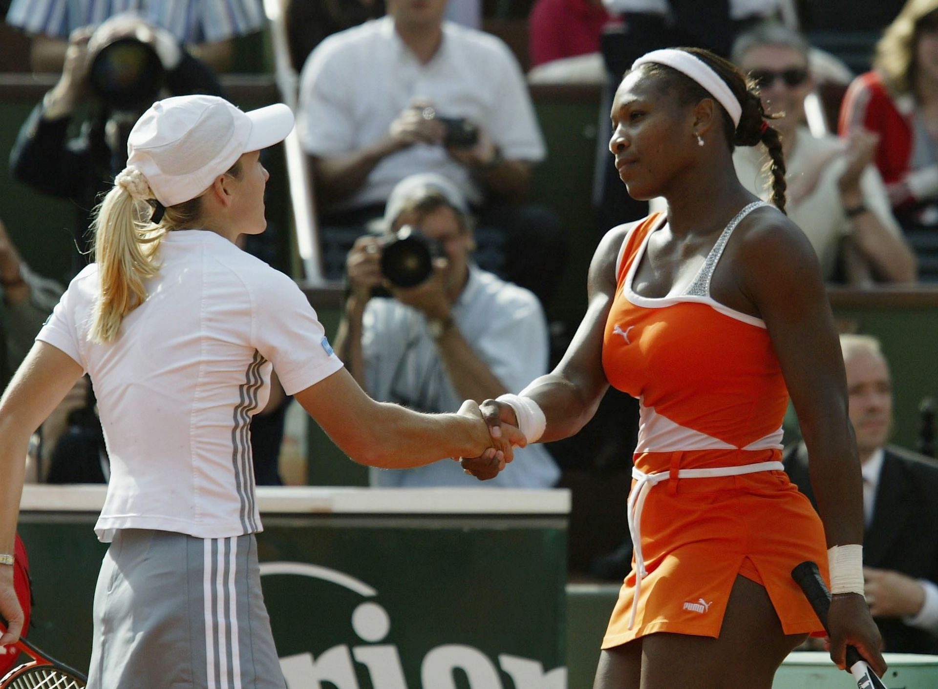Justine Henin shakes hands with Serena Williams at the 2003 French Open