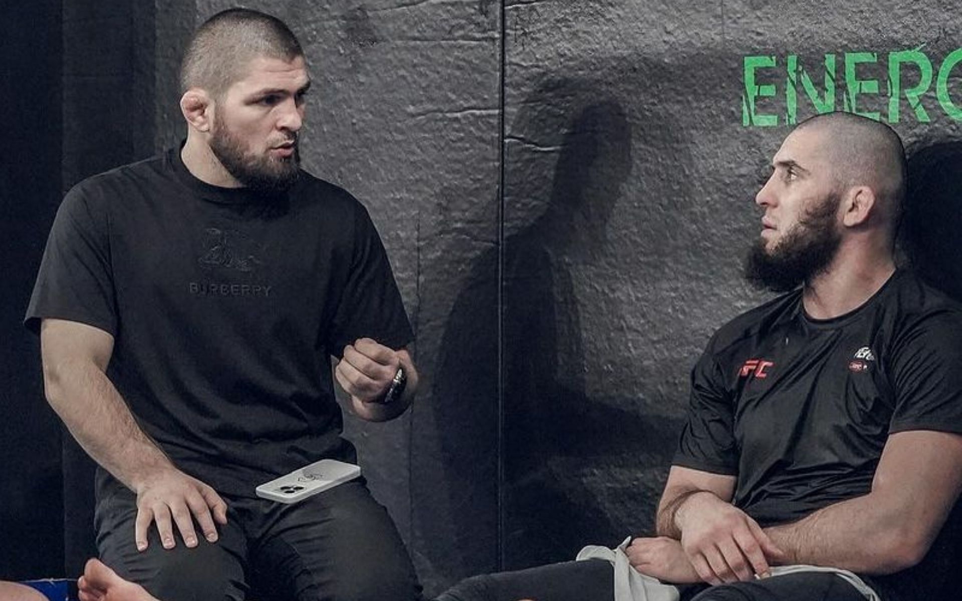 Khabib Nurmagomedov (left) gives instructions to Islam Makhachev (right) [Image courtesy @islam_makhachev on Instagram]