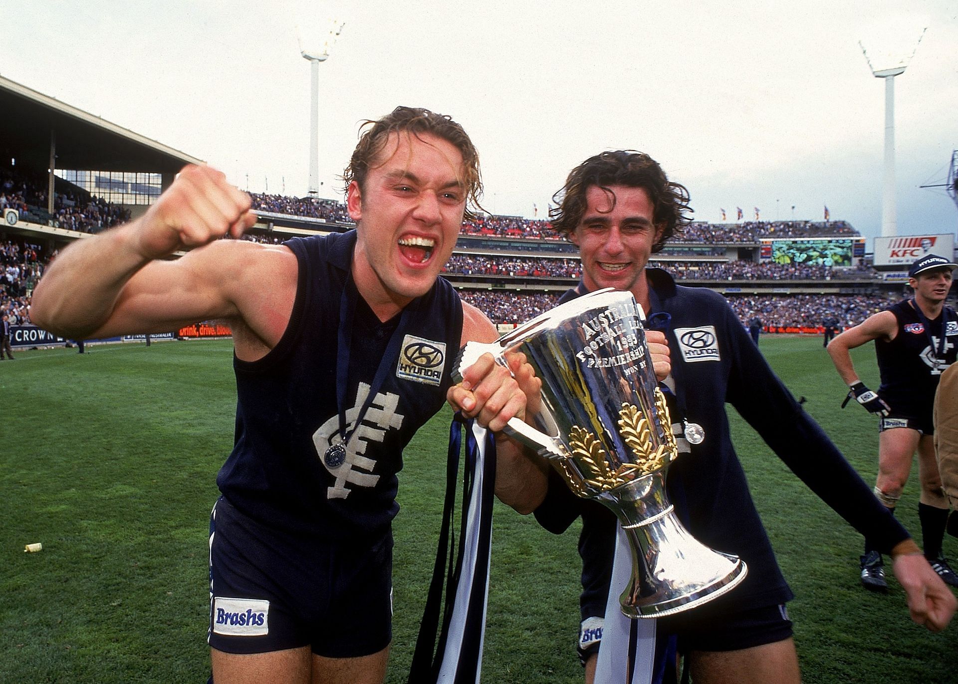 Anthony Koutoufides and Ang Christou of the Blues celebrate after winning the 1995 AFL Grand Final