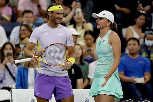 Rafael Nadal (L) and Iga Swiatek (R) during a charity match ahead of the 2022 US Open