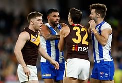 Axed North Melbourne midfielder Tarryn Thomas charged with alleged harassment as police investigation continues