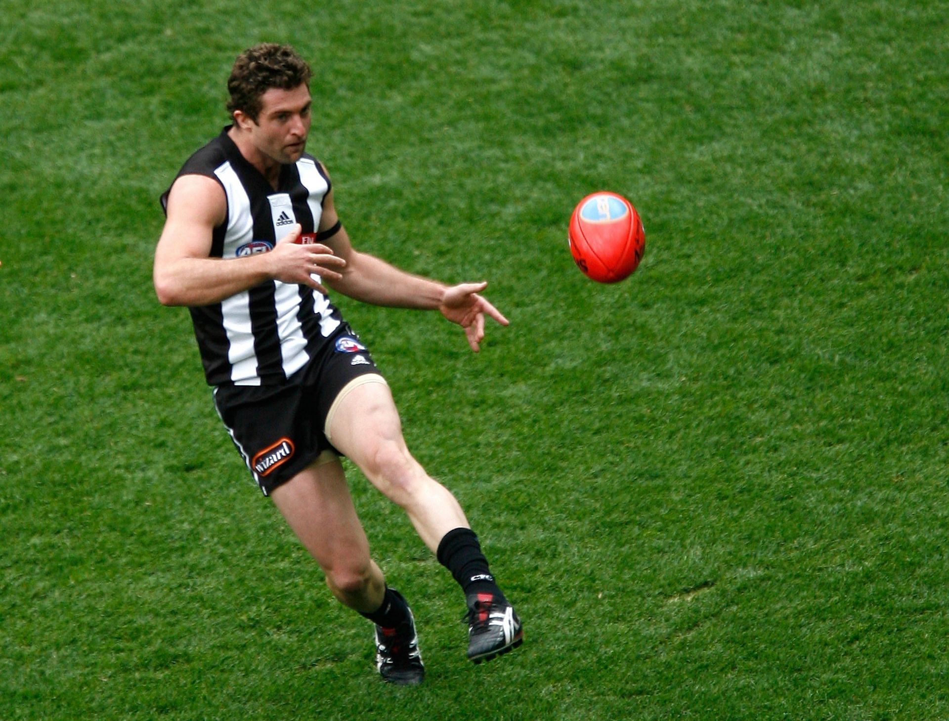 Shane O&#039;Bree of the Magpies kicks the ball