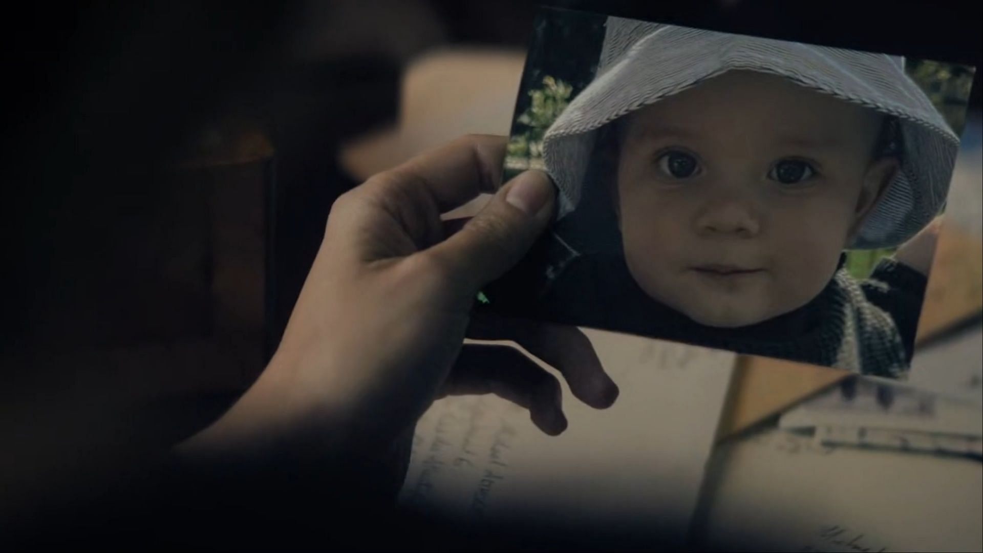 Imogen, looking at a picture of a baby (Image via Hulu)