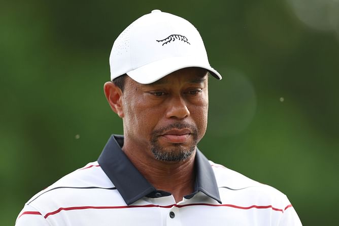 In Pictures: Tiger Woods spotted smoking a cigar with Grammy-winning popstar at his charity gala