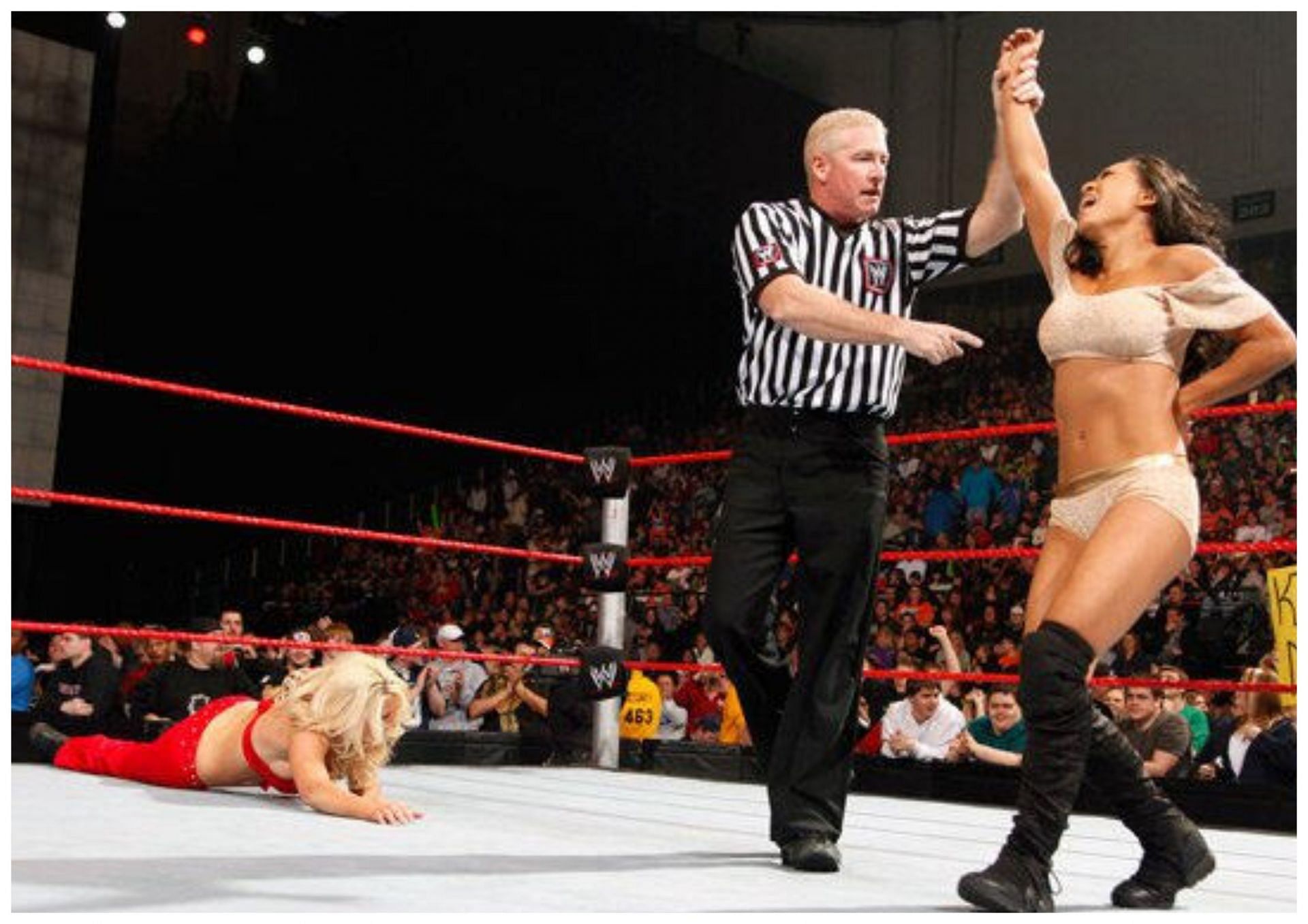 Gail Kim (right) spent a total of five years with WWE (2002-2004, 2008-2011) (Photo credit: WWE.com)