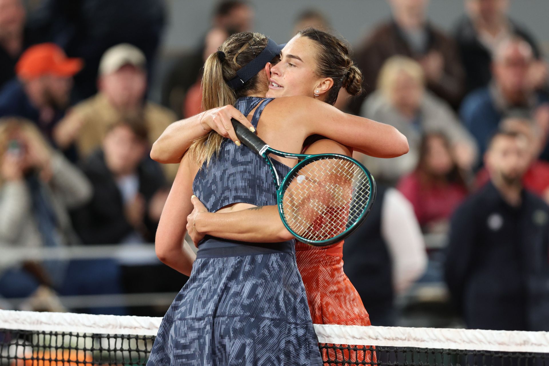 Aryna Sabalenka and Paula Badosa embrace after their French Open match