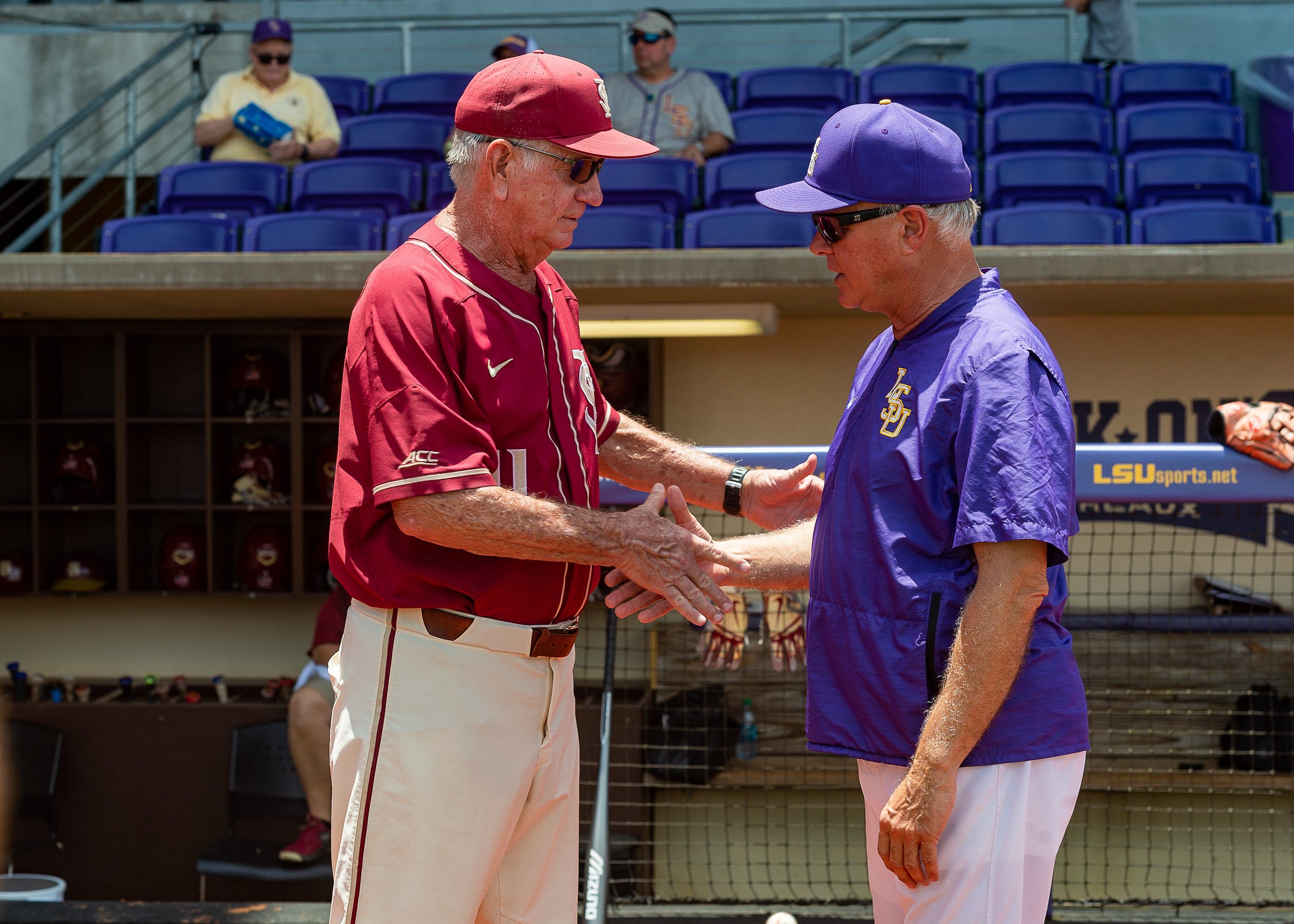 NCAA Baseball&#039;s greatest coaches Paul Mainieri and Mike Martin share a moment.