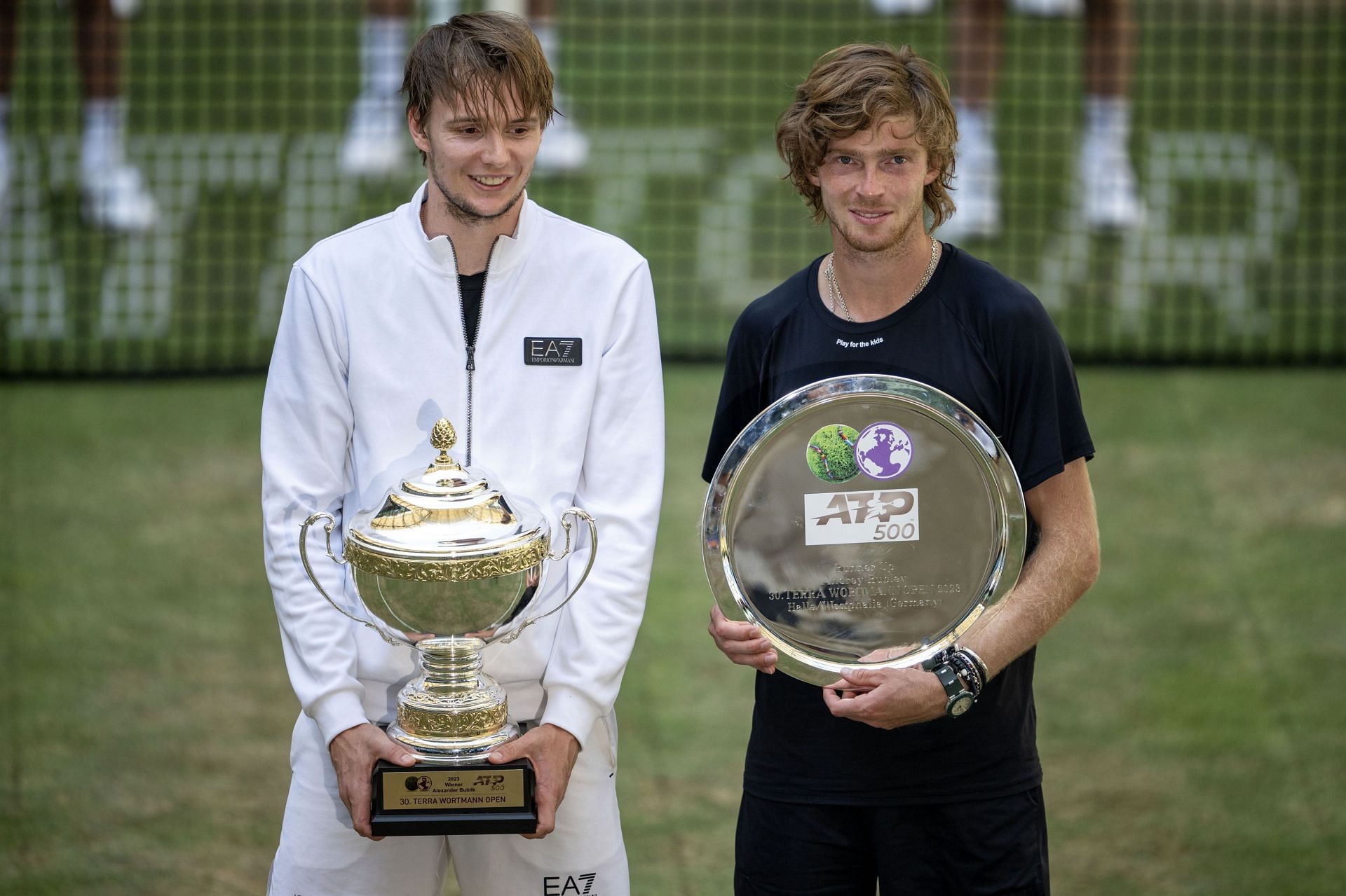 Alexander Bublik and Andrey Rublev with the 2023 Halle trophies.