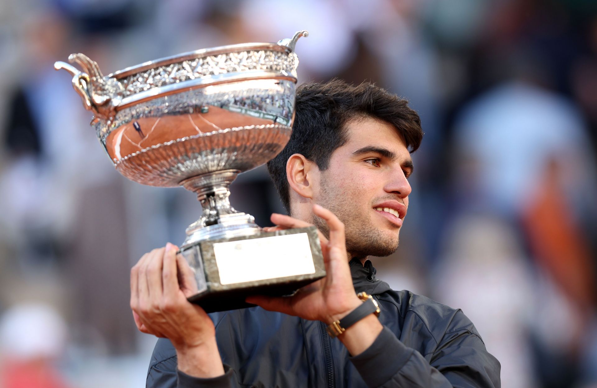 Carlos Alcaraz poses with the French Open trophy