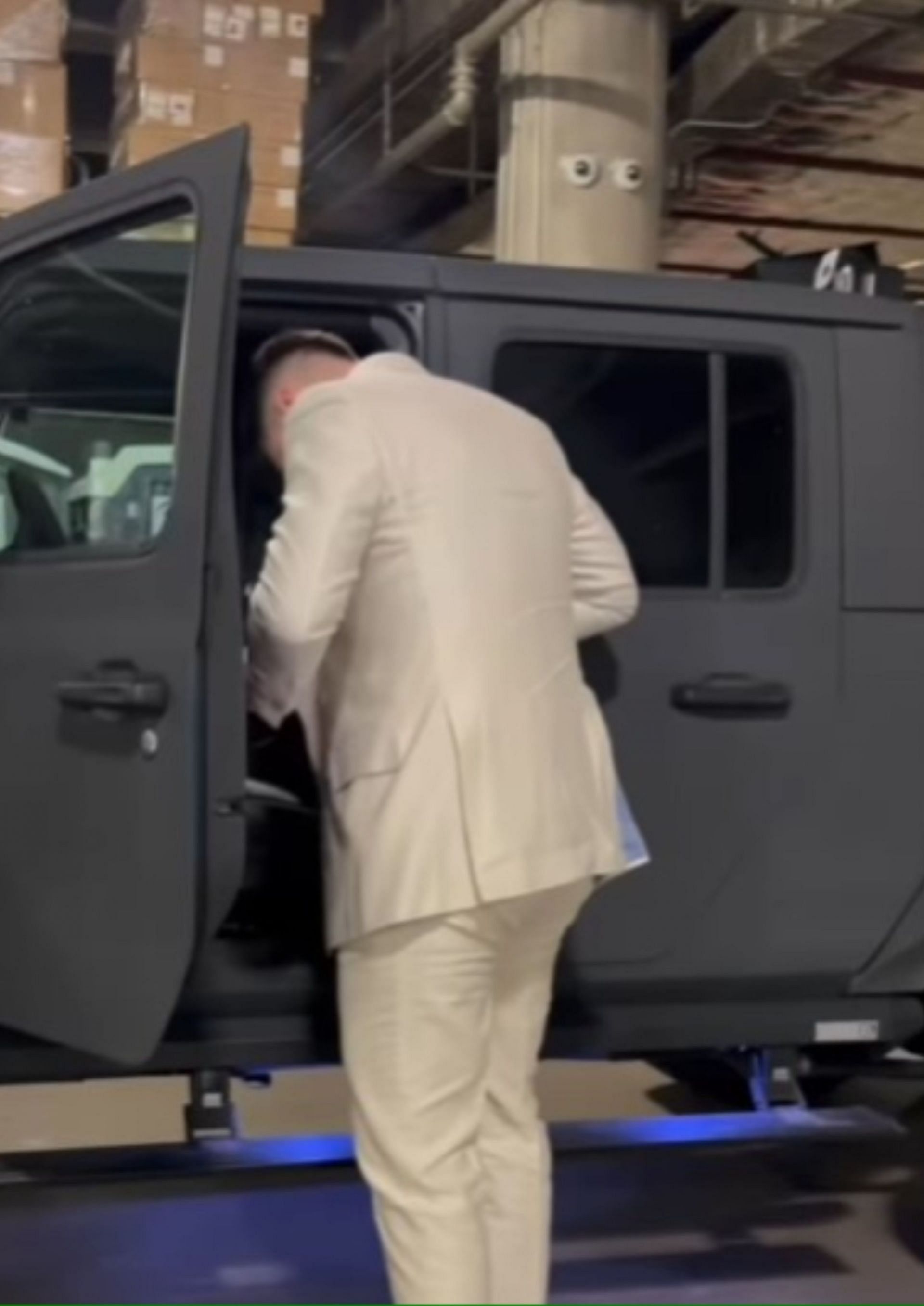 Doncic steps out of his $250k vehicle for Game 3.
