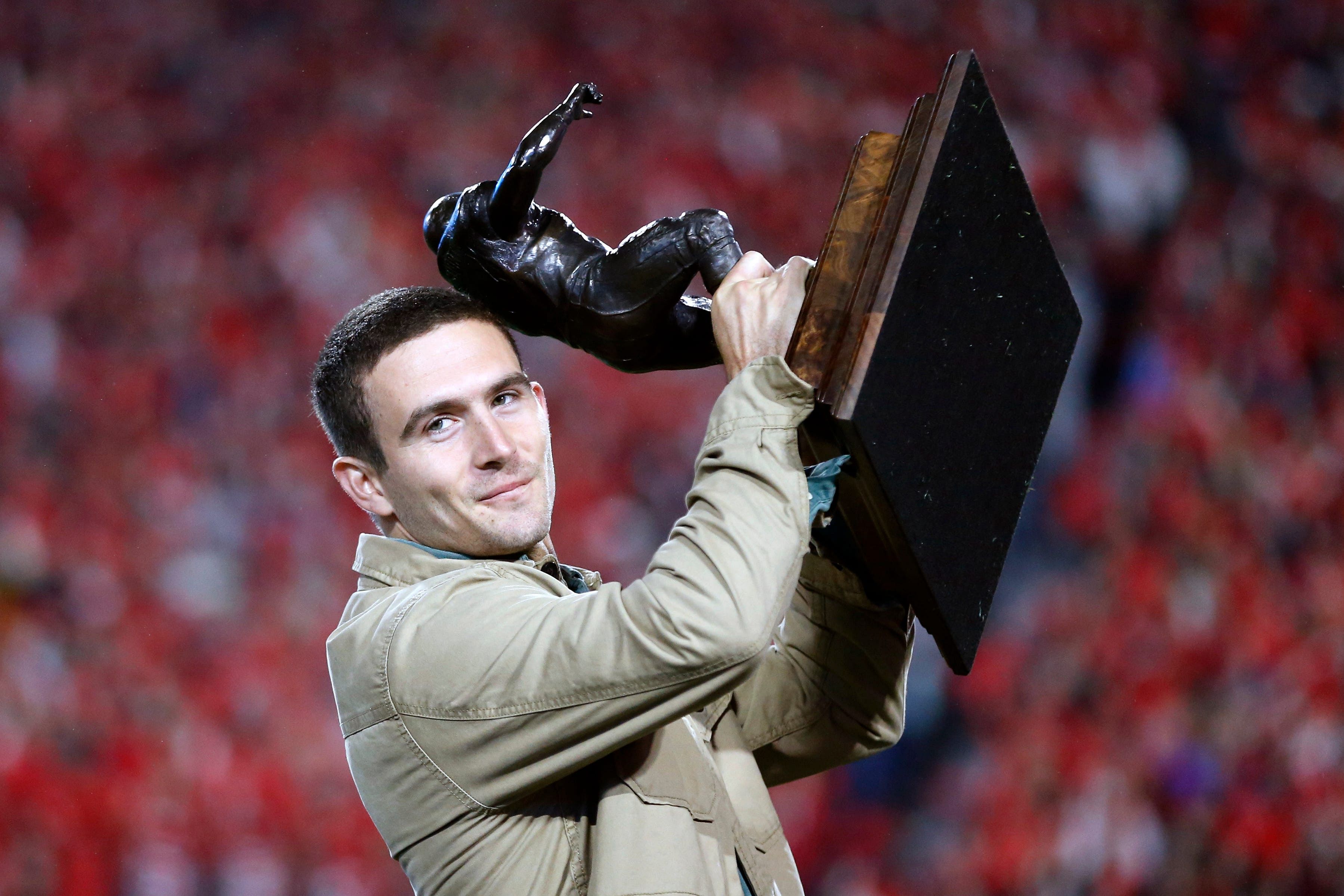 Syndication: Online Athens: Former Georgia star quarterback Stetson Bennett receives the Burlsworth Trophy during the first half of a NCAA college football game against Ole Miss in Athens, Ga., on Saturday, Nov. 11, 2023.