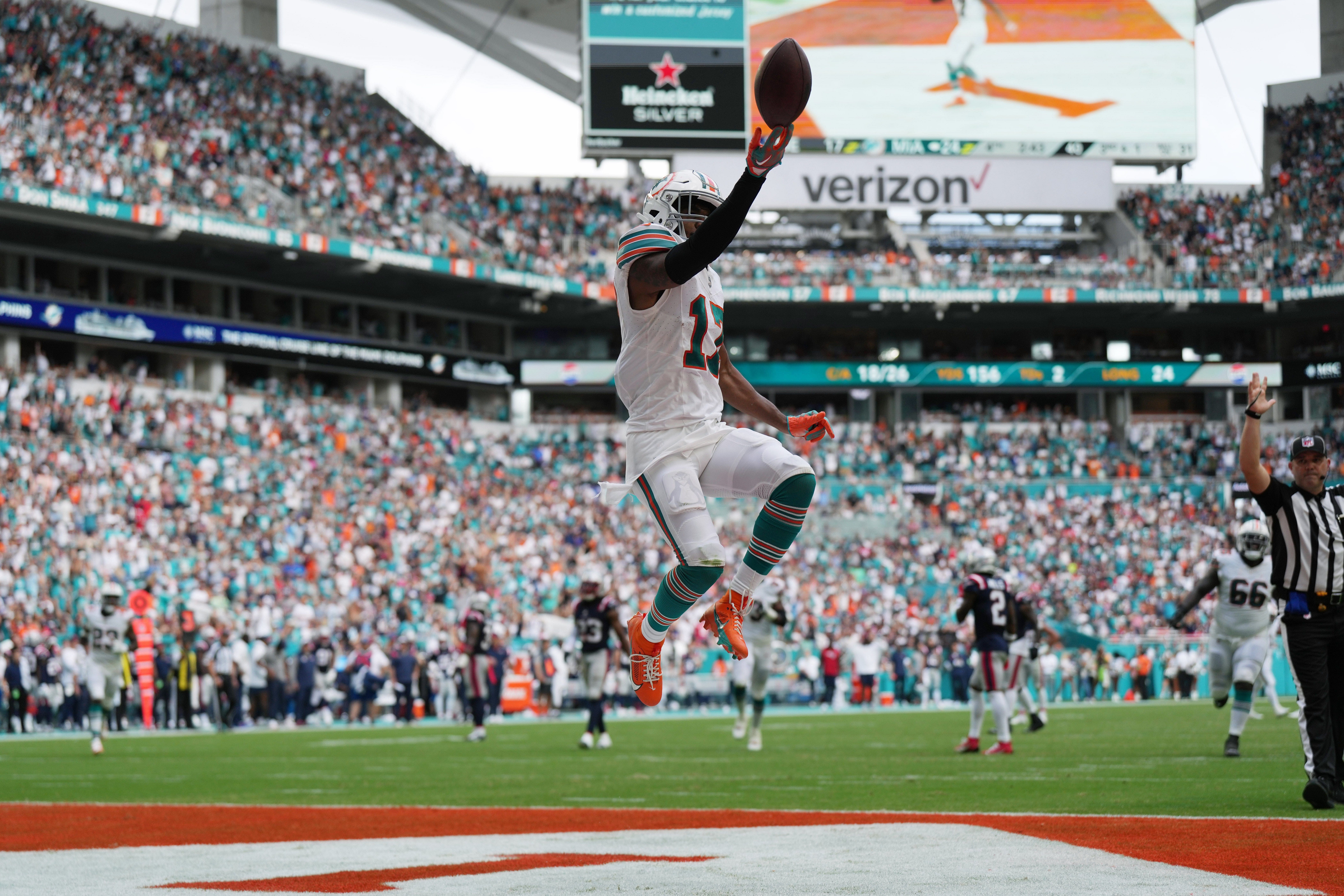 Syndication: Palm Beach Post: Miami Dolphins wide receiver Jaylen Waddle (17) flips the ball in the air as he scores a touchdown against the New England Patriots during the second half of an NFL game at Hard Rock Stadium in Miami Gardens, Oct. 29, 2023.