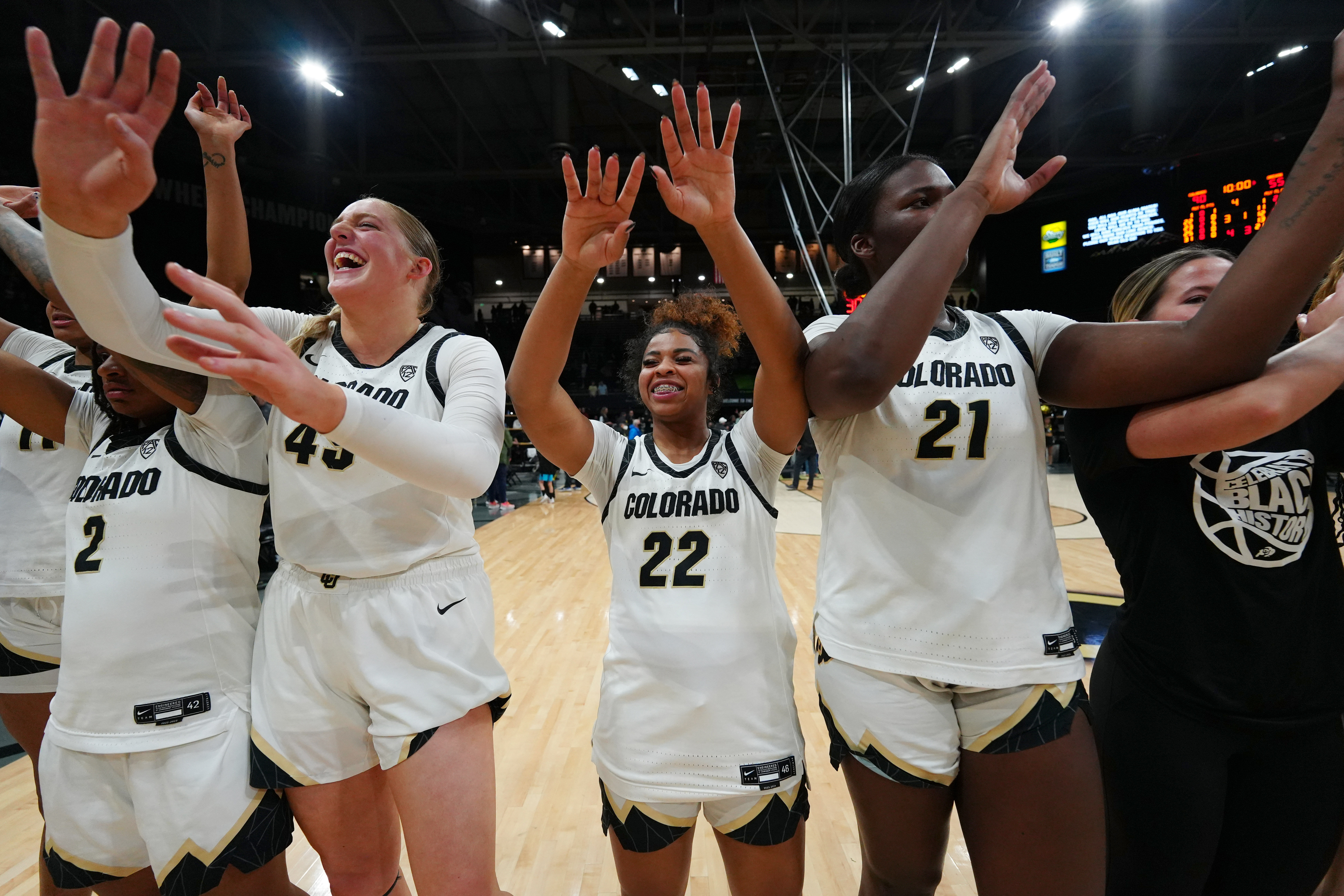 Colorado Buffaloes guard Tameiya Sadler (2), forward Charlotte Whittaker (45) and former guard Shelomi Sanders (22).