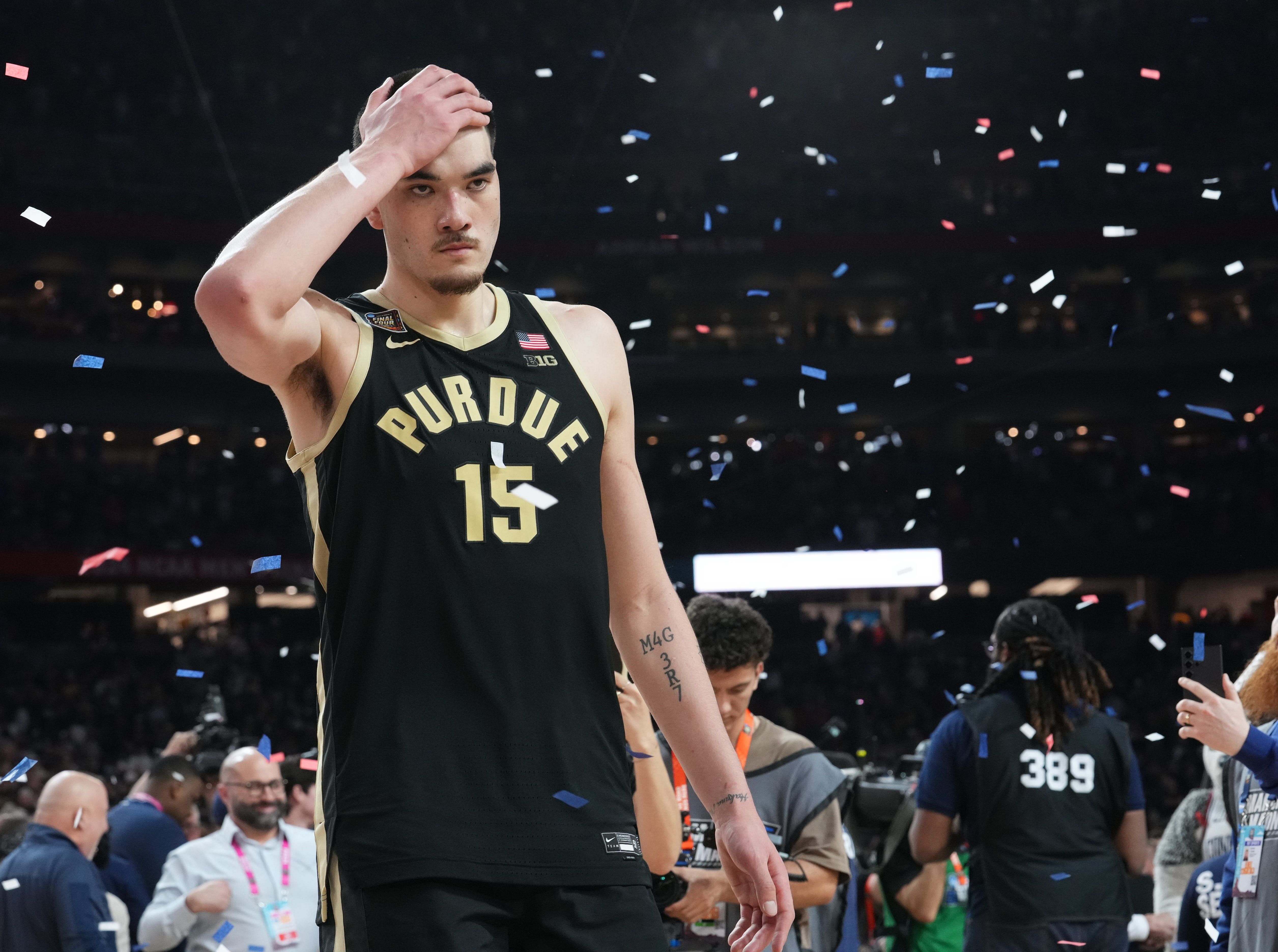 A dejected Purdue Boilermakers center Zach Edey (15) walks off the court.