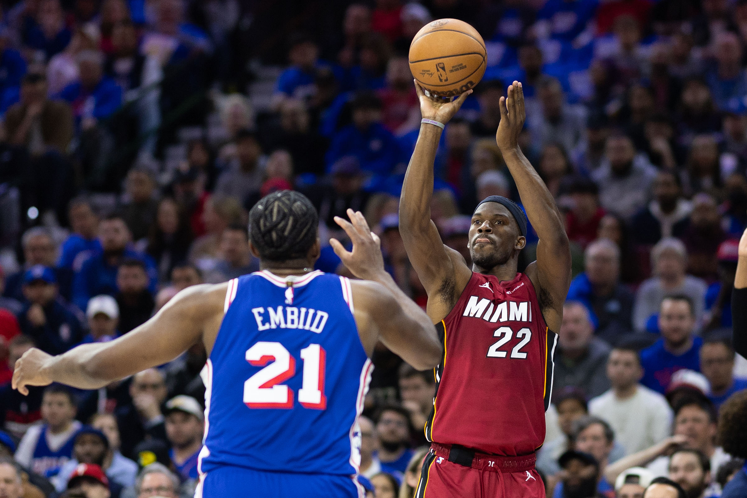 Miami Heat guard Jimmy Butler shooting over Philadelphia 76ers center Joel Embiid