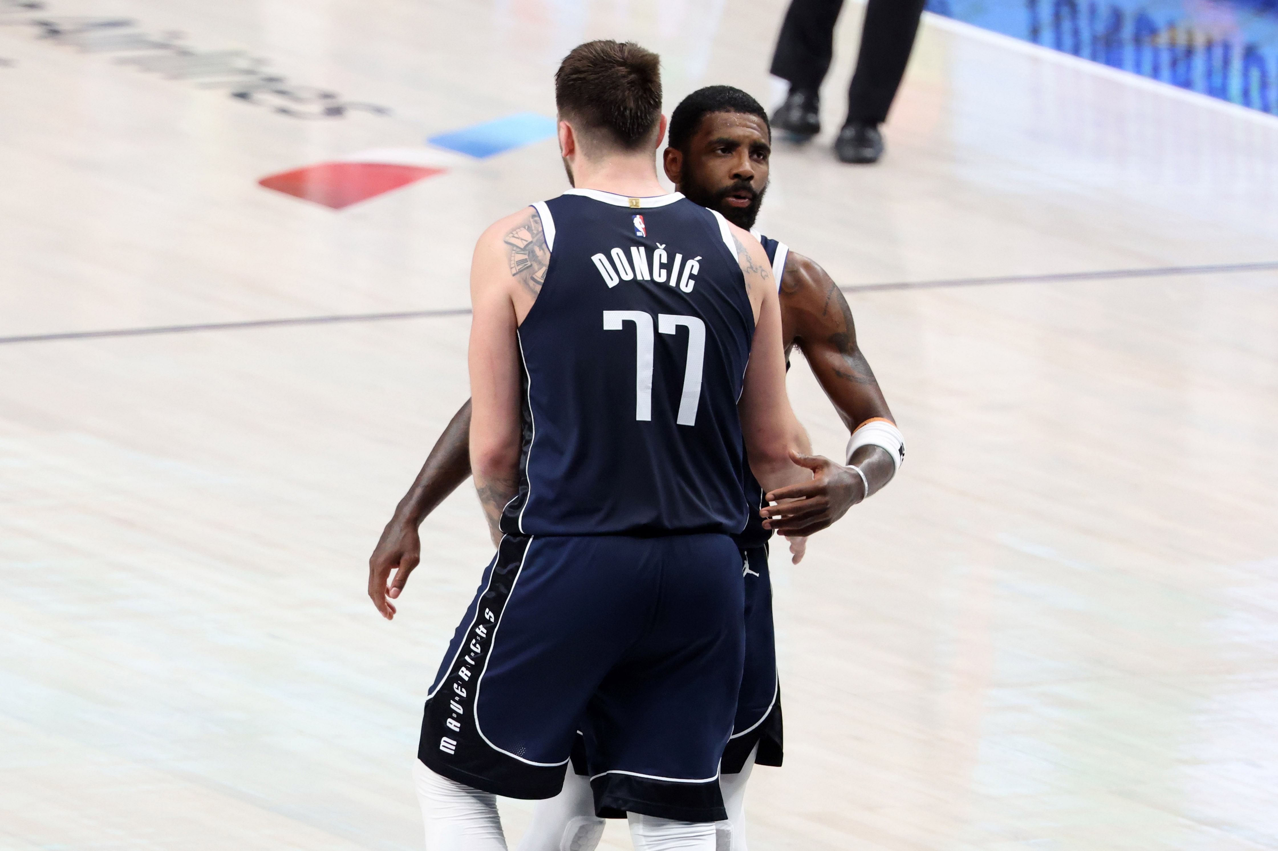 Kyrie Irving shows support for Luka Doncic after fouling out in Game 3.