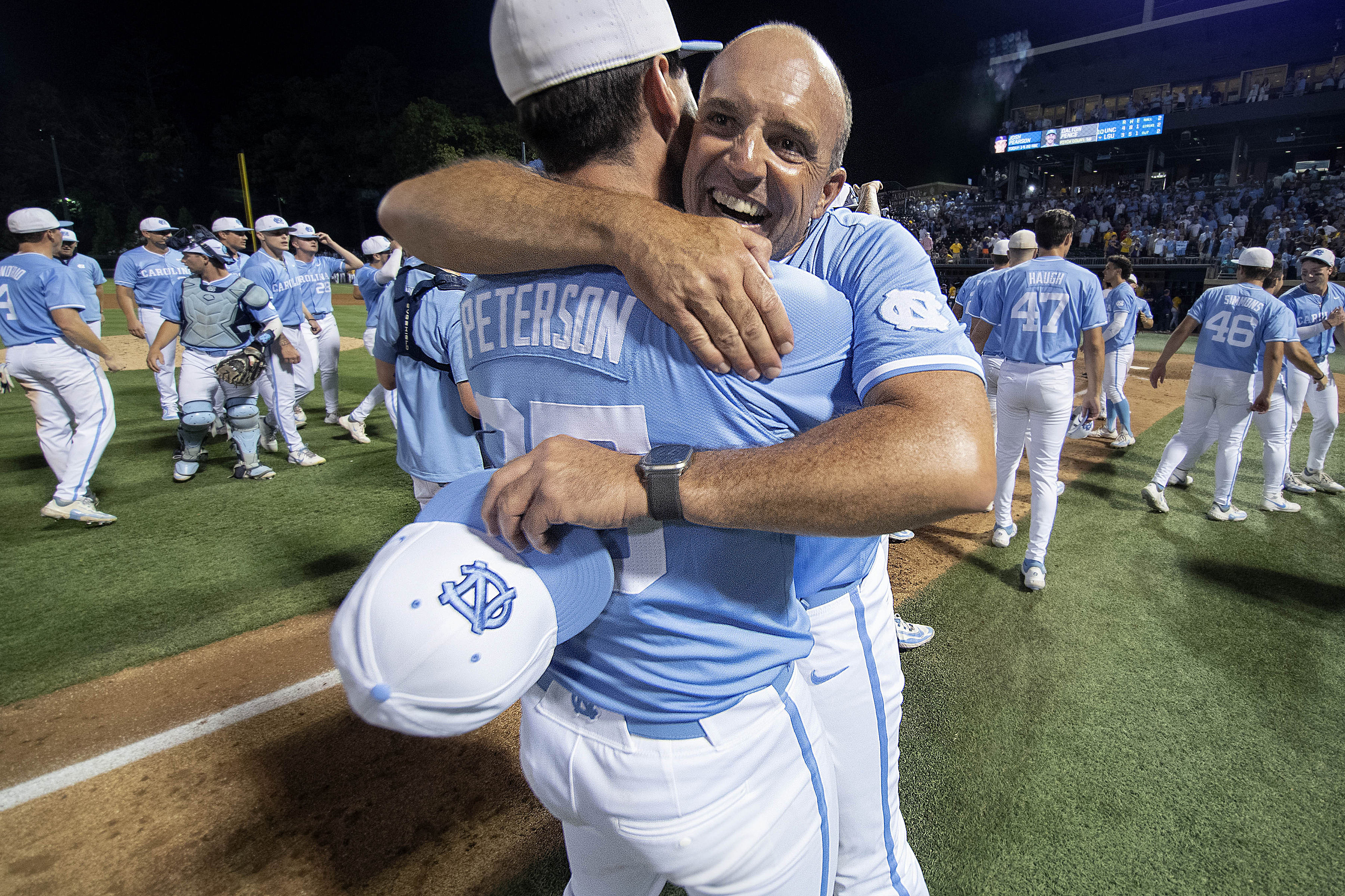 North Carolina Tar Heels Head Coach Scott Forbes (21) and pitcher Ben Peterson (25) celebrate their team&rsquo;s win over the LSU Tigers in the NCAA baseball regional at the Boshamer Stadium.