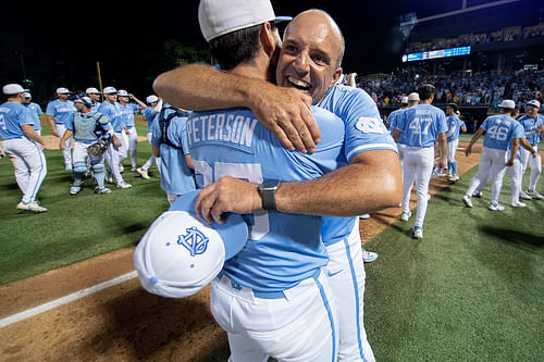 North Carolina Tar Heels Head Coach Scott Forbes (21) and pitcher Ben Peterson (25) celebrate their team’s win over the LSU Tigers in the NCAA baseball regional at the Boshamer Stadium.