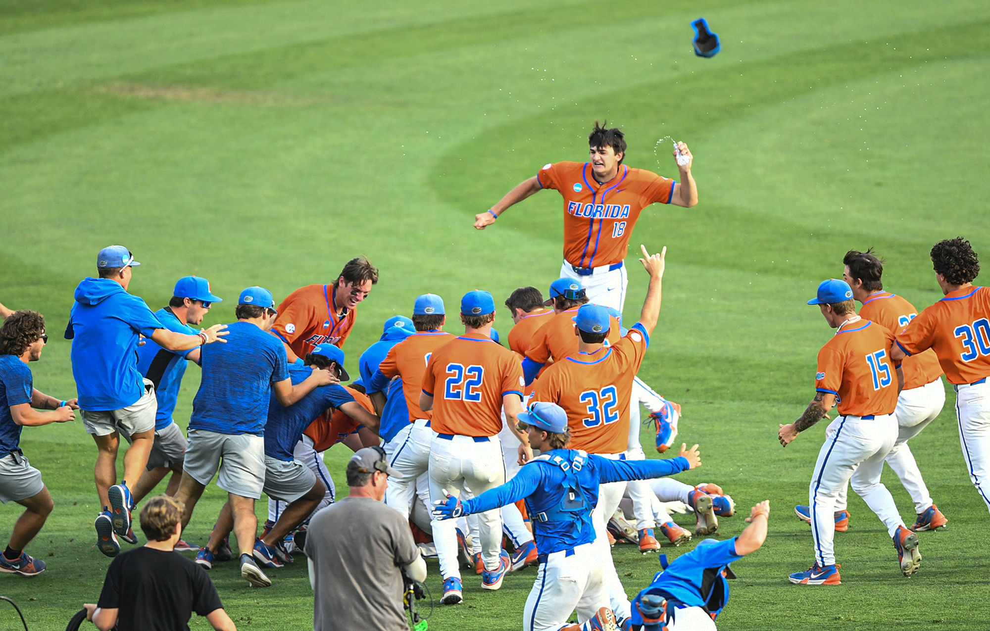 The Florida Gators celebrate after sophomore Michael Robertson hit a walk-off double to help the Gators win against Clemson in the NCAA baseball Super Regional at Doug Kingsmore Stadium.