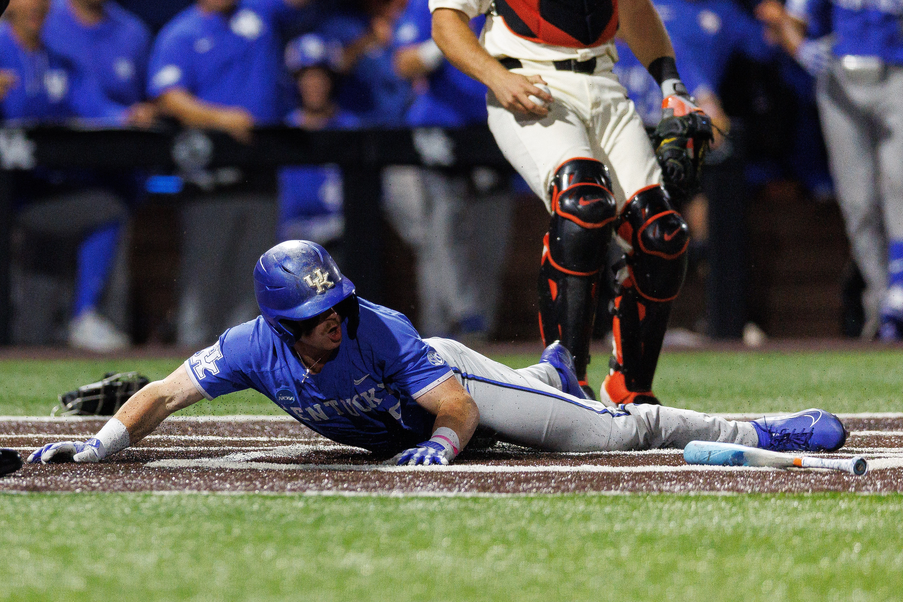 Nolan McCarthy slides in safe in the seventh inning to help Kentucky claim a 3-2 lead.