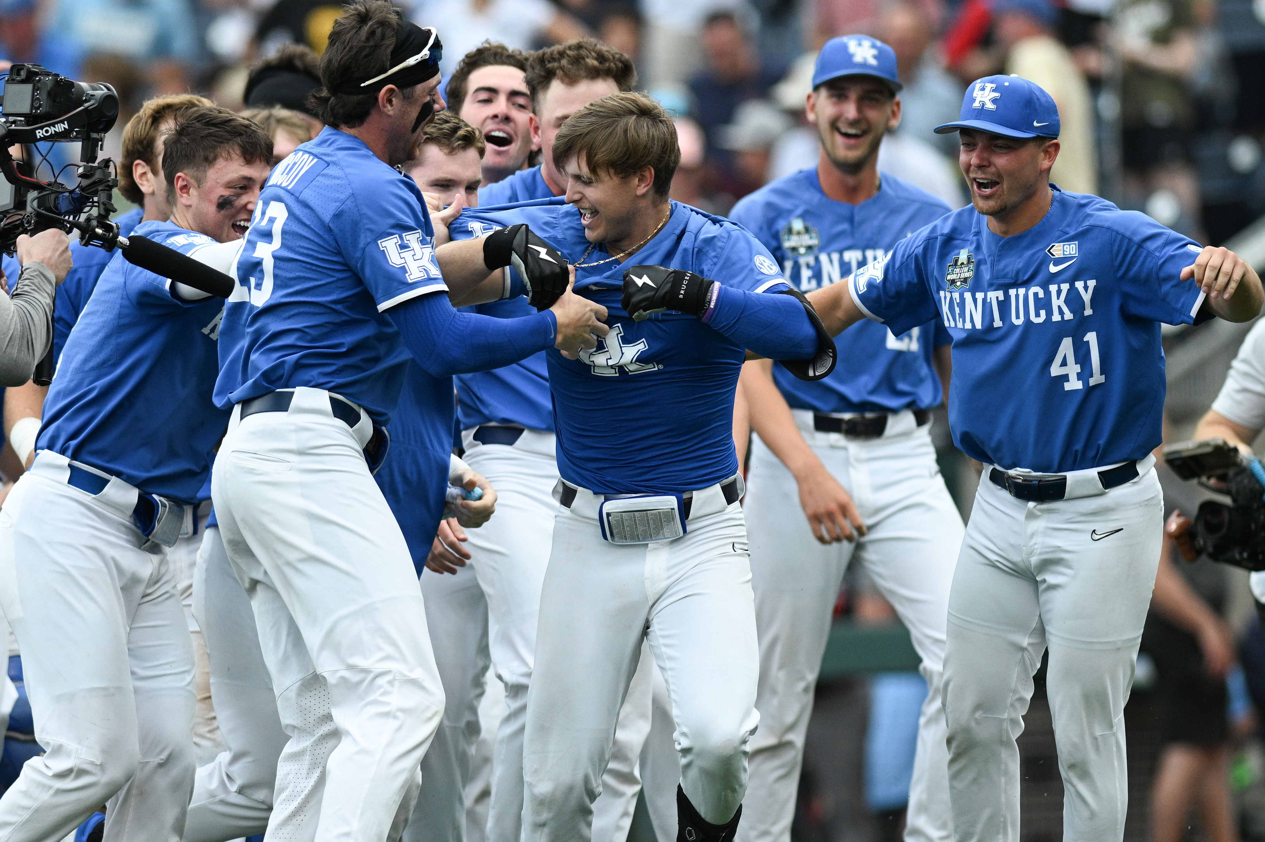 Mitchell Daly celebrates with teammates following Kentucky&#039;s 10th-inning walk-off win over NC State.