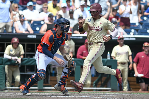 Florida State Seminoles third baseman Cam Smith scores against the Virginia Cavaliers.