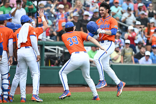 Jac Caglianone and his teammates celebrate his three-run home run against the NC State Wolfpack.