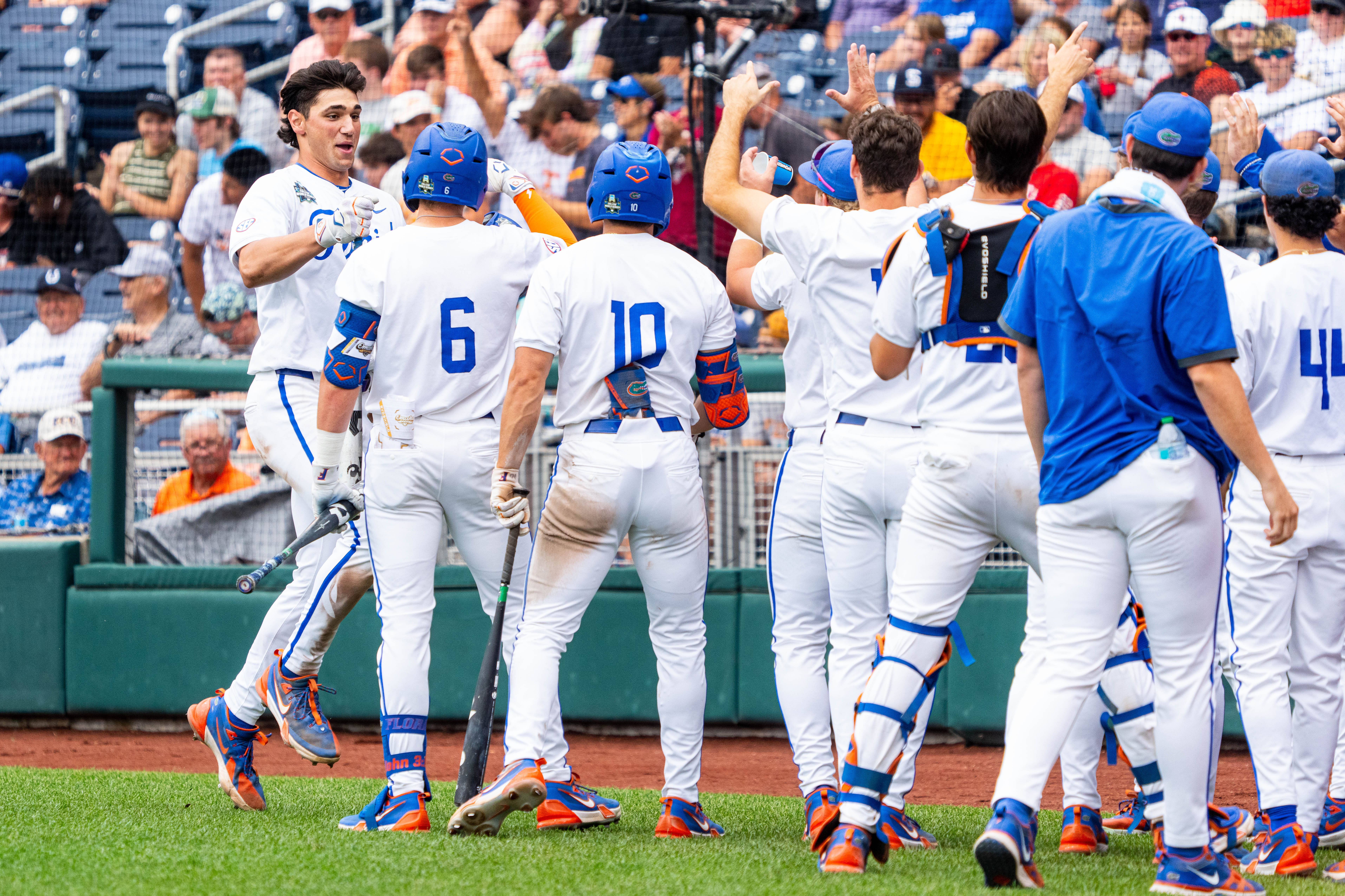 Jac Caglianone celebrates with his teammates after a home run against Kentucky.