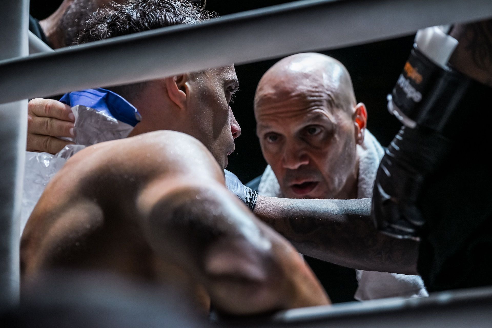 Coach Angelo Di Bella coaching his son Jonathan between rounds at ONE Friday Frights 68.