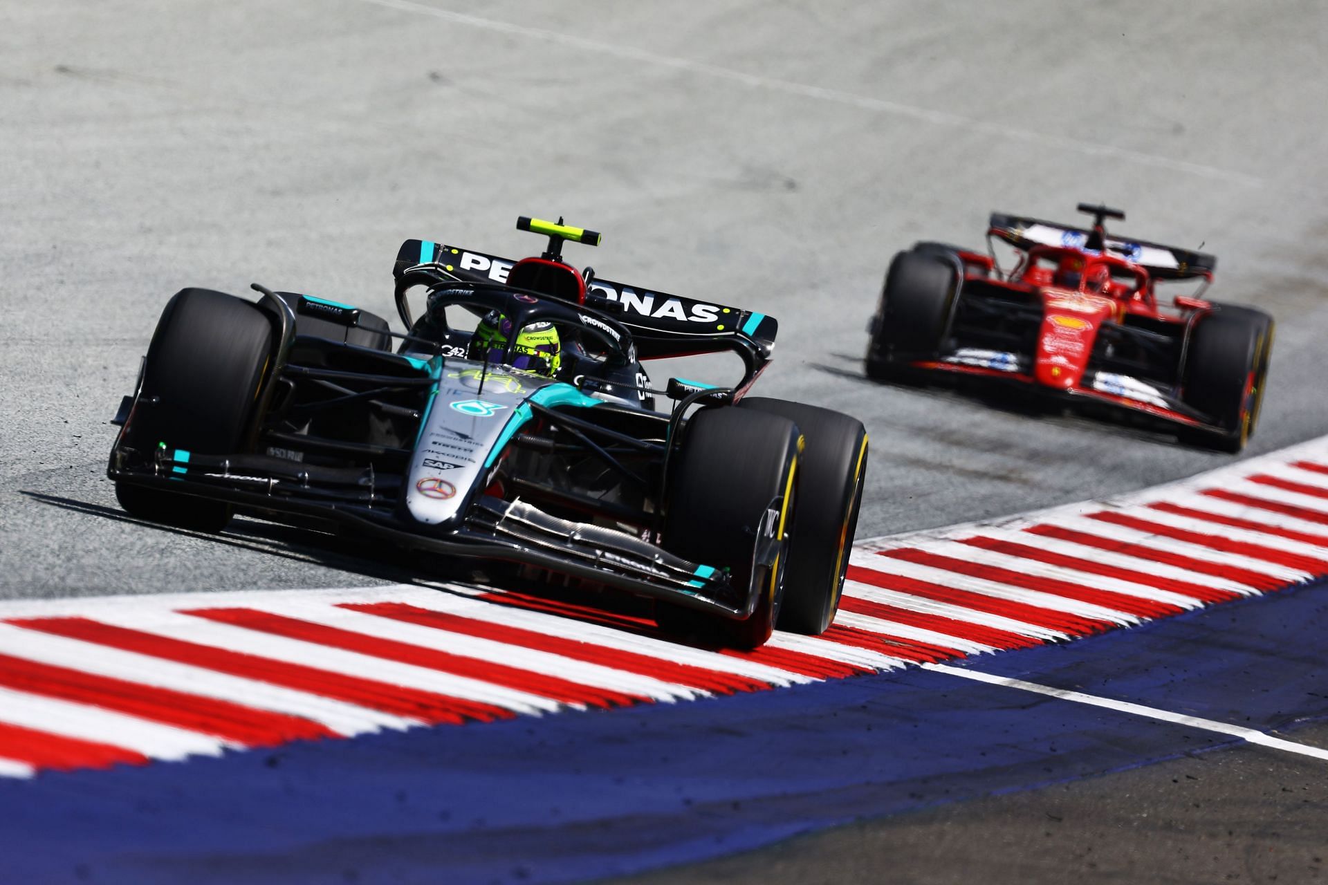 Lewis Hamilton of Great Britain driving the (44) Mercedes AMG Petronas F1 Team W15 leads Charles Leclerc of Monaco driving the (16) Ferrari SF-24 during the Sprint ahead of the F1 Grand Prix of Austria at Red Bull Ring on June 29, 2024 in Spielberg, Austria. (Photo by Mark Thompson/Getty Images)